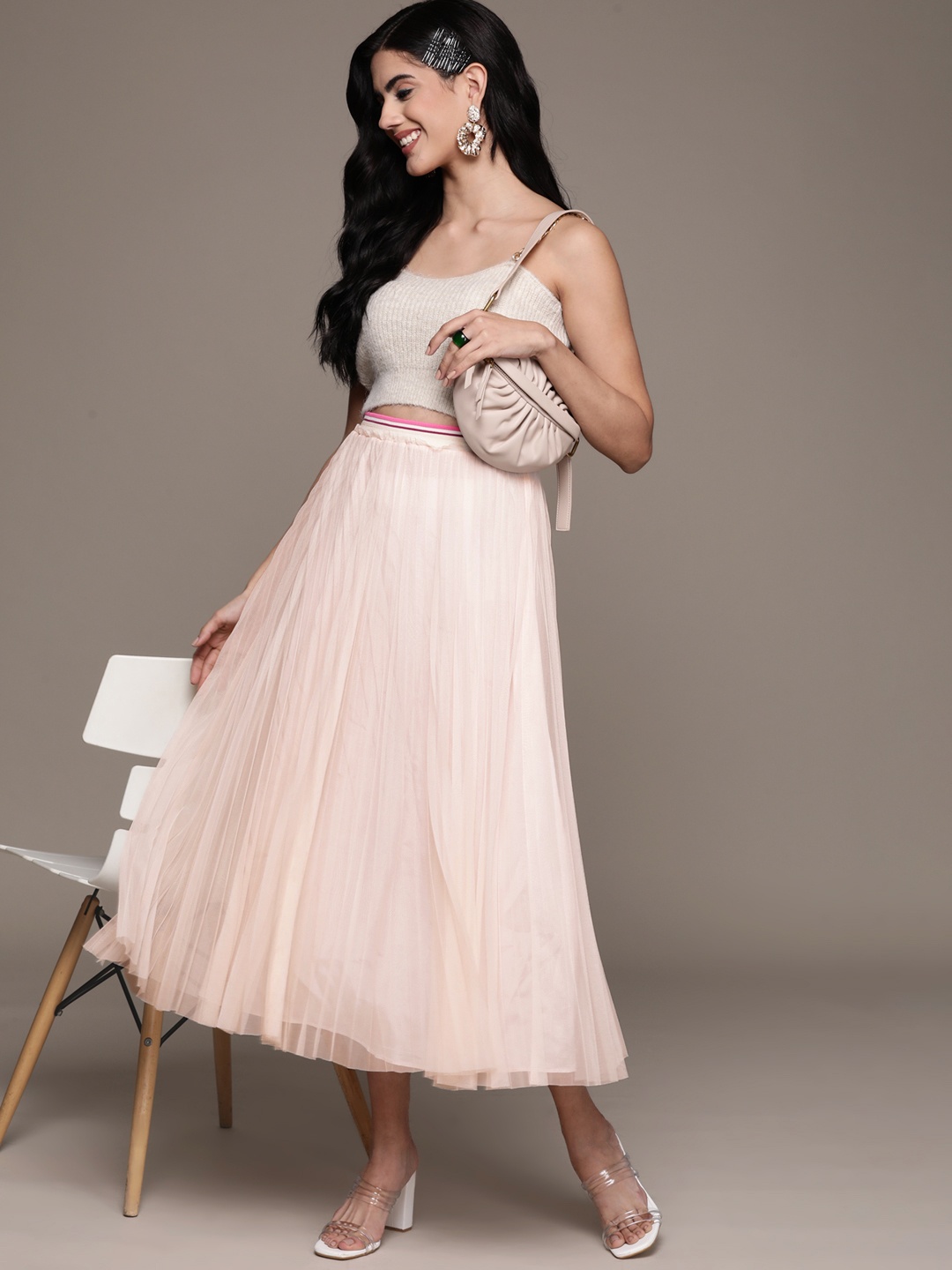 Label Ritu Kumar Pale Pink Solid Accordian Pleats Tulle Polyester Net Flared Midi Skirt
Label Ritu Kumar Pale Pink Solid Accordian Pleats Tulle Polyester Net Flared Midi Skirt