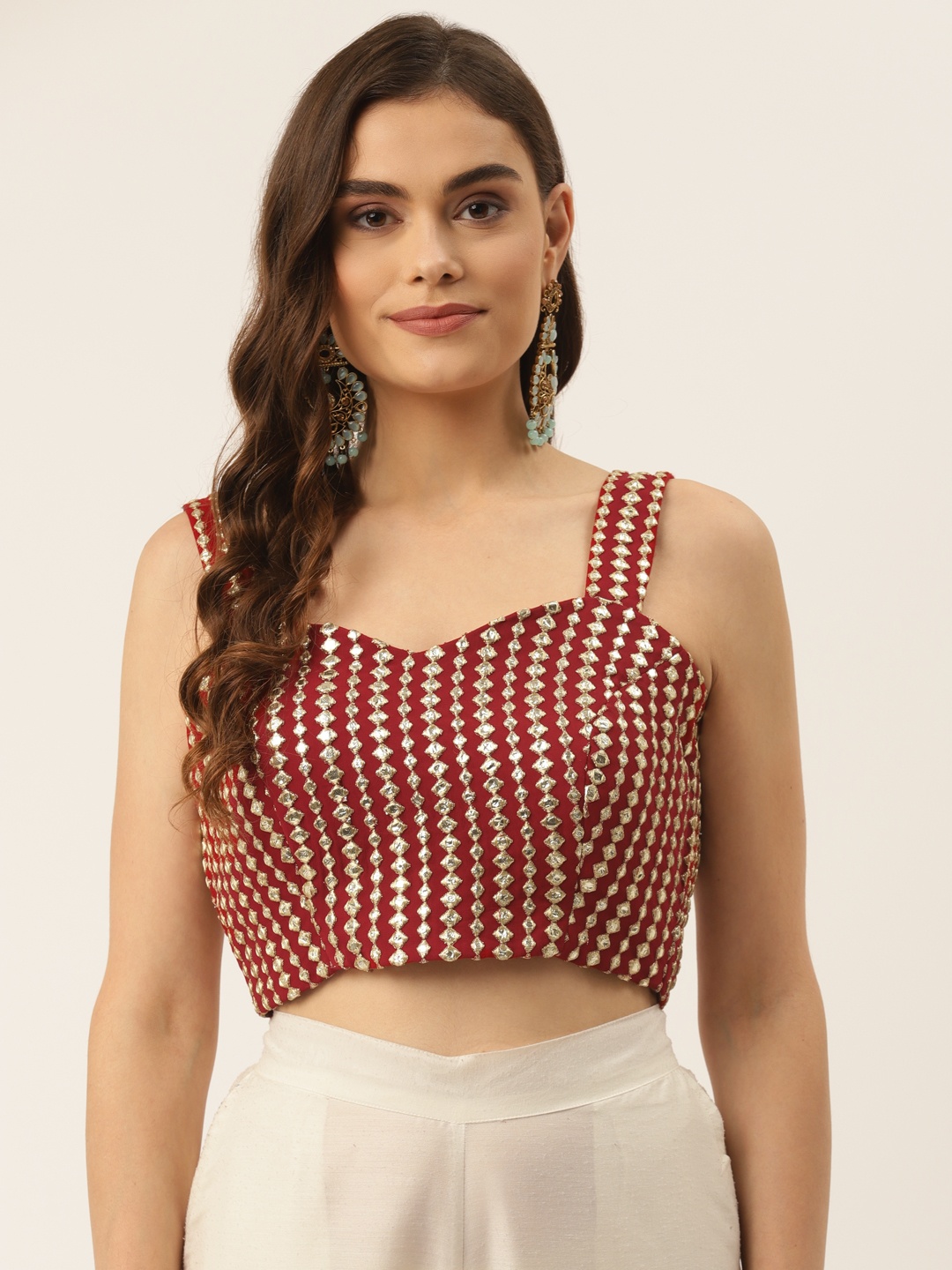 NDS Niharikaa Designer Studio Maroon & Golden Embroidered Mirror Work Padded Saree Blouse
NDS Niharikaa Designer Studio Maroon & Golden Embroidered Mirror Work Padded Saree Blouse