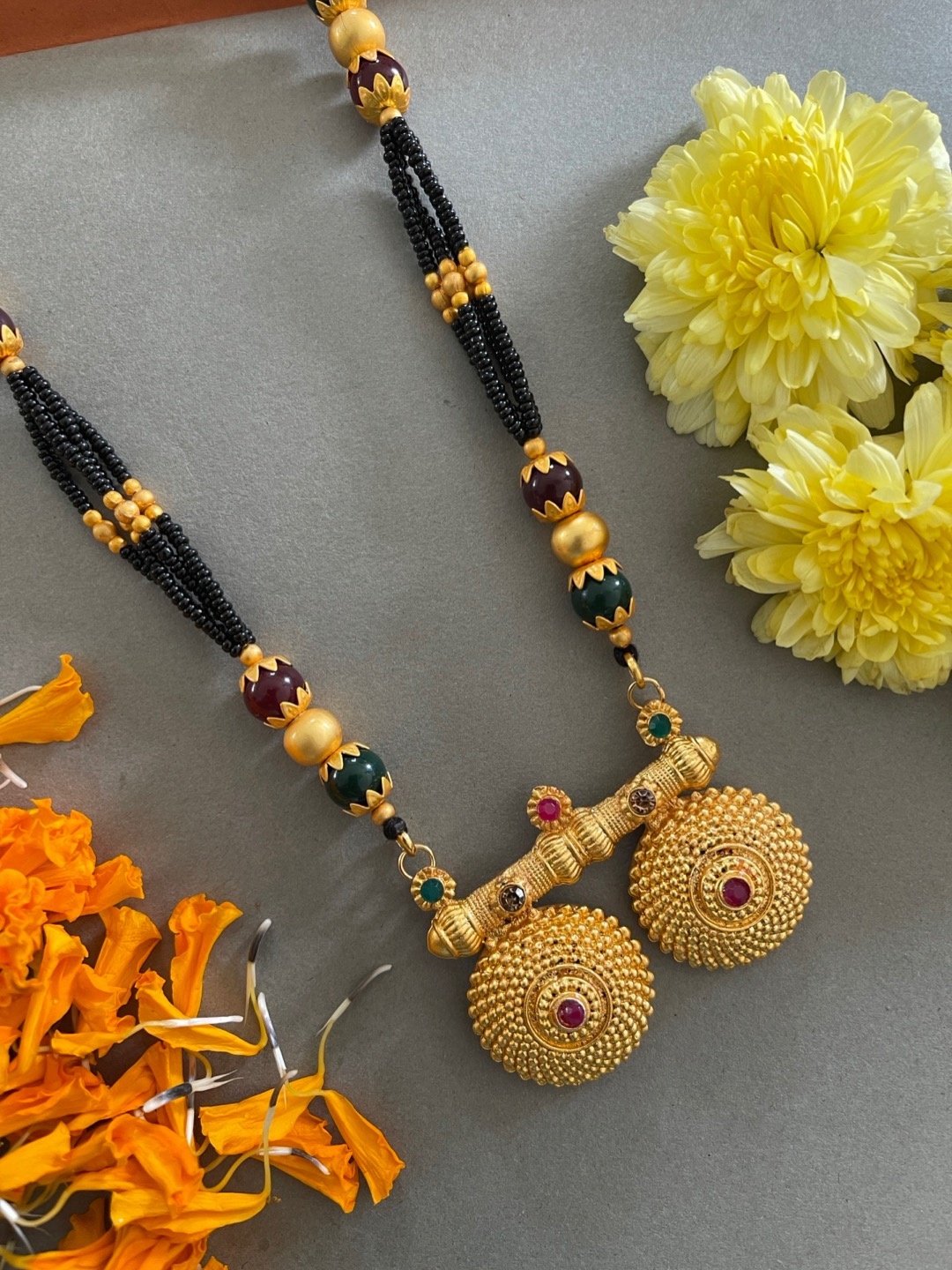 Digital Dress Room Gold-Plated Red & Green Stone-Studded & Black Beaded Mangalsutra
Digital Dress Room Gold-Plated Red & Green Stone-Studded & Black Beaded Mangalsutra