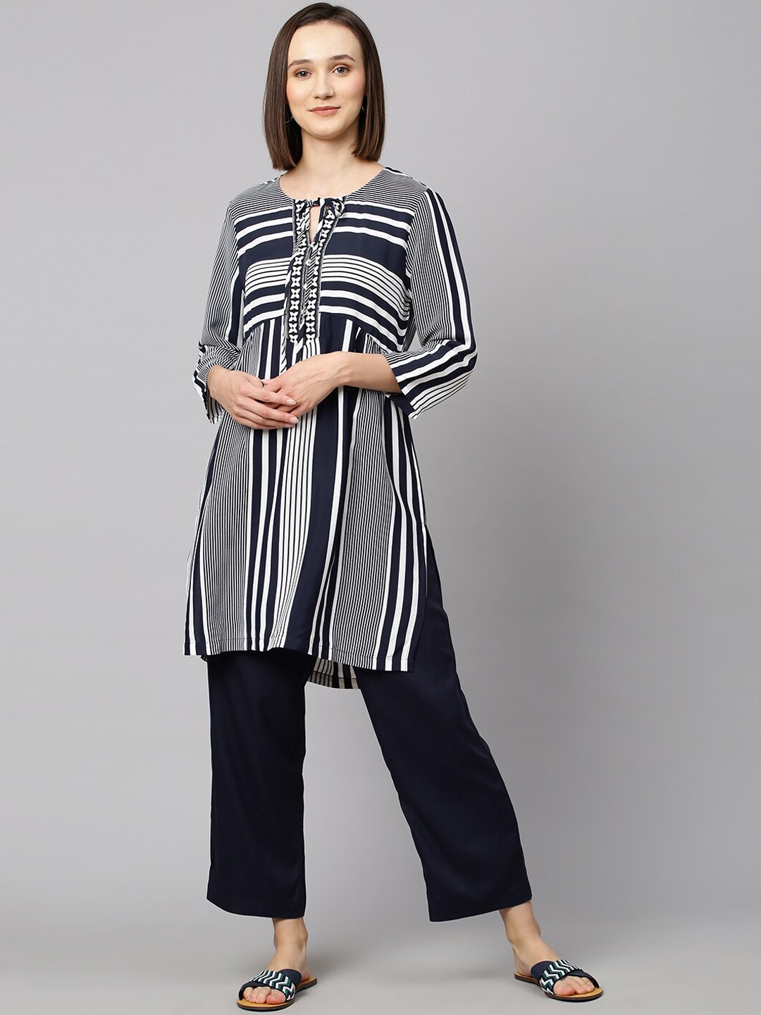 Modern Indian by CHEMISTRY Women Navy Blue & White Striped Thread Work Kurta with Palazzos
Modern Indian by CHEMISTRY Women Navy Blue & White Striped Thread Work Kurta with Palazzos