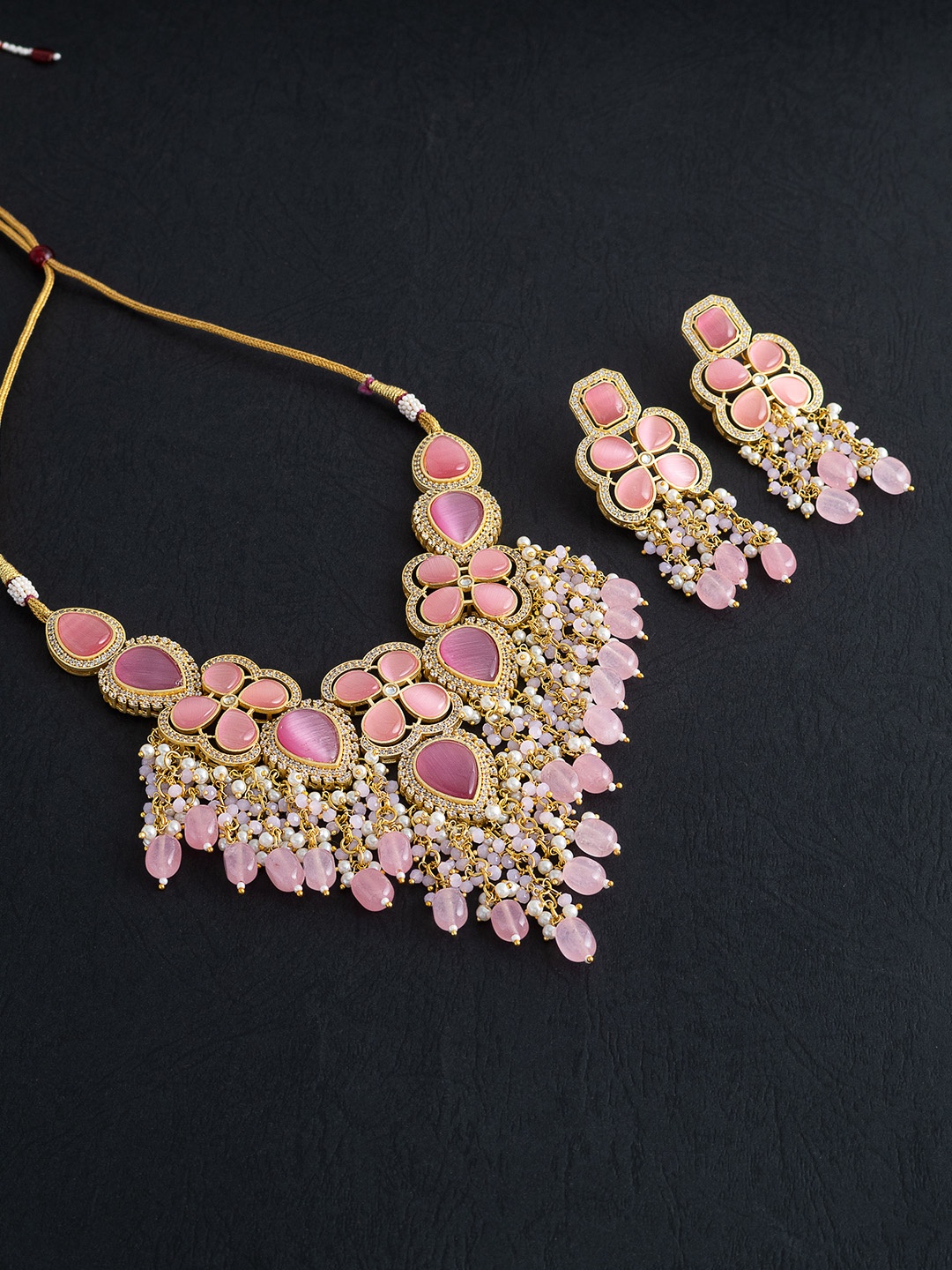 Golden Peacock Pink & Gold-Toned Quartz & Kundan-Studded Beaded Handcrafted Jewellery Set
Golden Peacock Pink & Gold-Toned Quartz & Kundan-Studded Beaded Handcrafted Jewellery Set