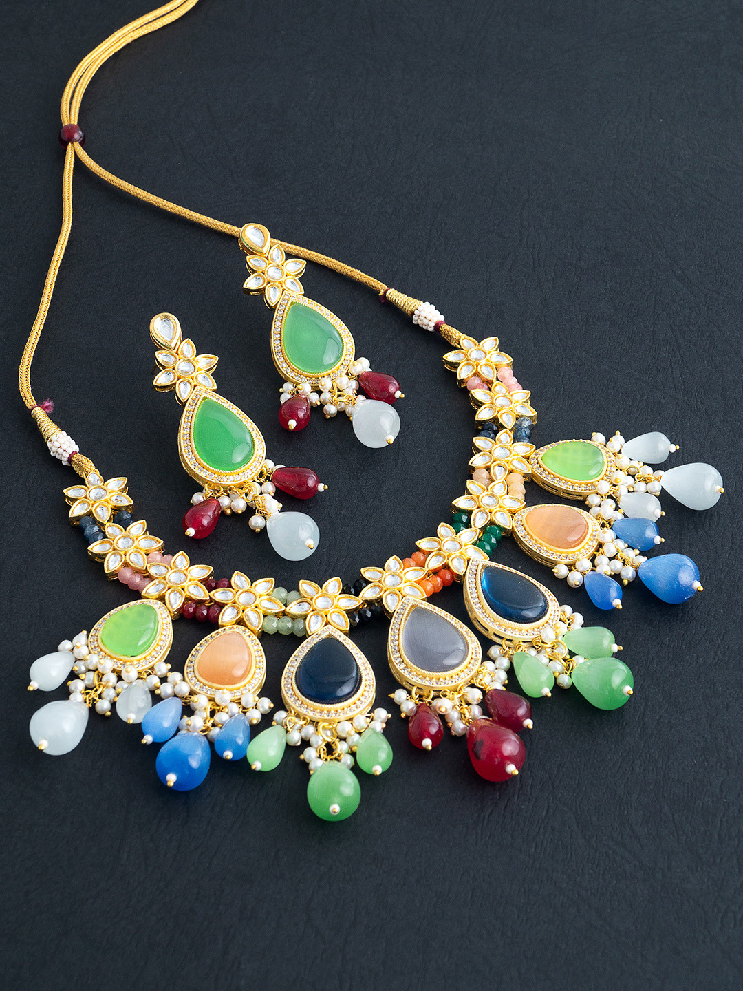 Golden Peacock Multicoloured Gold-Toned Kundan Beaded Stone Studded Beaded Jewellery Set, Multi
Golden Peacock Multicoloured Gold-Toned Kundan Beaded Stone Studded Beaded Jewellery Set, Multi