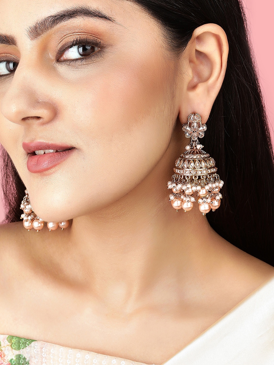 Rubans 22K Gold-Plated Kundan Studded & Glossy Light Peach Pearl Beaded Jhumka Earrings
Rubans 22K Gold-Plated Kundan Studded & Glossy Light Peach Pearl Beaded Jhumka Earrings