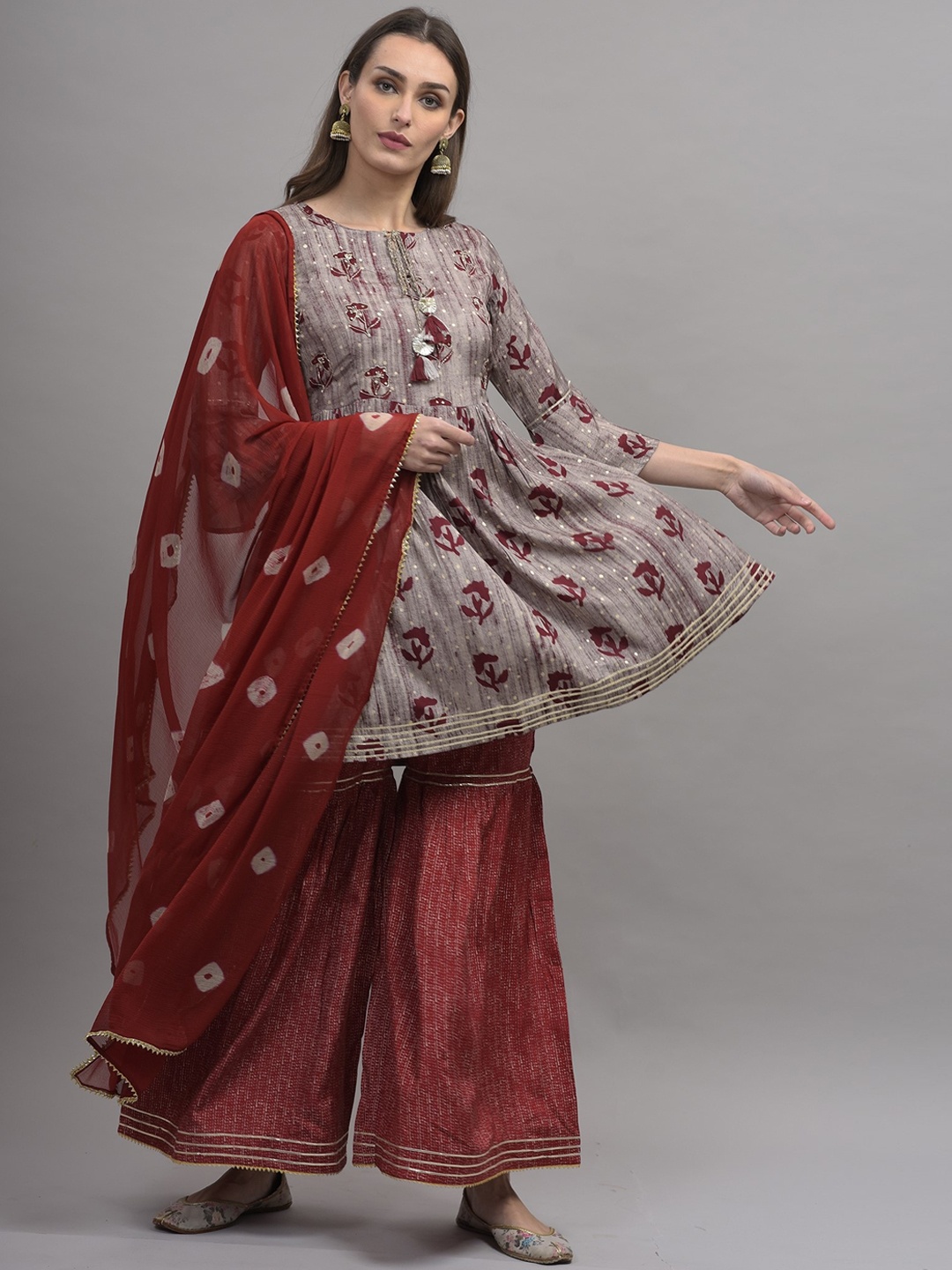 KALINI Women Grey Floral Printed Empire Gotta Patti Pure Cotton Kurti with Sharara & With Dupatta
KALINI Women Grey Floral Printed Empire Gotta Patti Pure Cotton Kurti with Sharara & With Dupatta