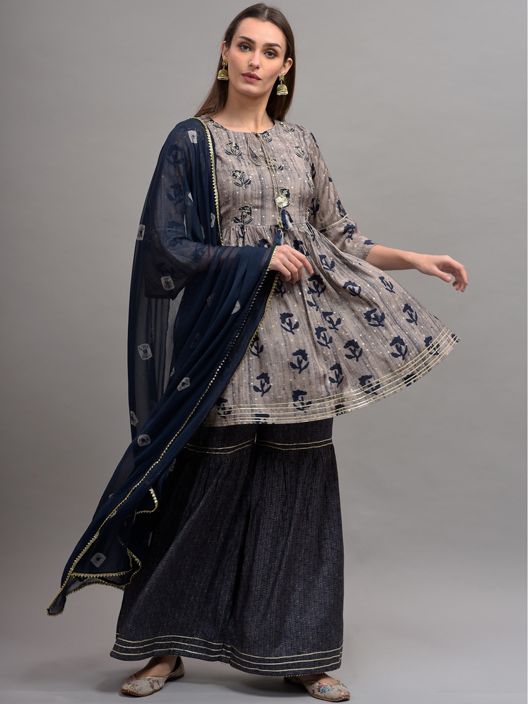 KALINI Women Blue & Grey Floral Printed Pleated Pure Cotton Kurta with Sharara & Dupatta
KALINI Women Blue & Grey Floral Printed Pleated Pure Cotton Kurta with Sharara & Dupatta