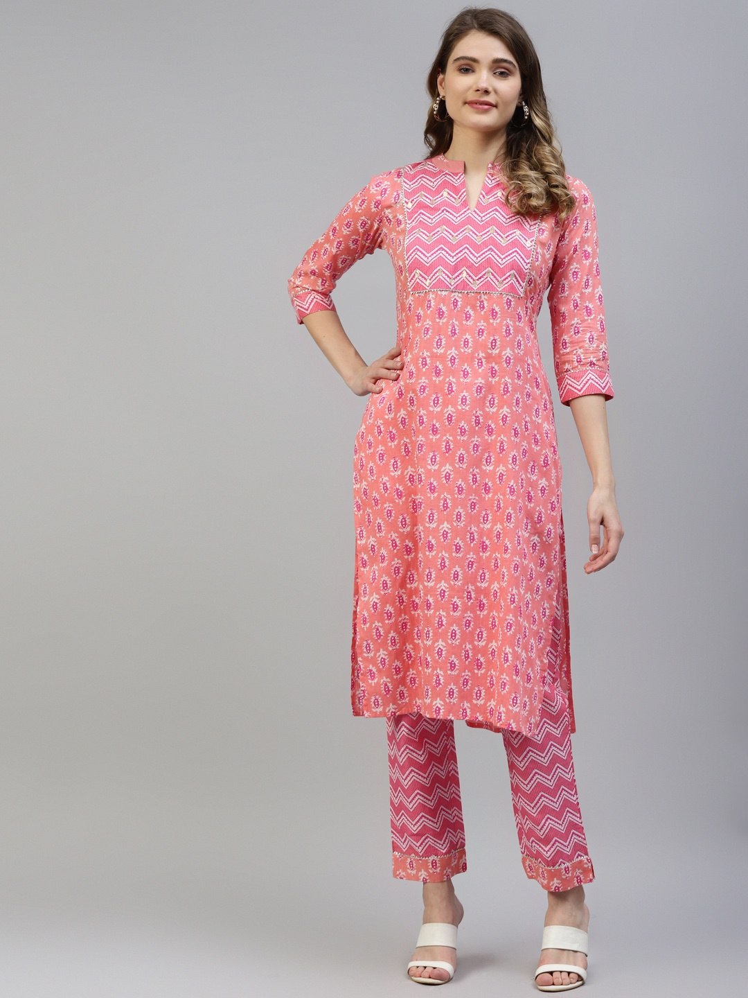 MYAZA Women Peach-Coloured & Pink Cotton Floral Print Gotta Patti Kurta with Trousers
MYAZA Women Peach-Coloured & Pink Cotton Floral Print Gotta Patti Kurta with Trousers