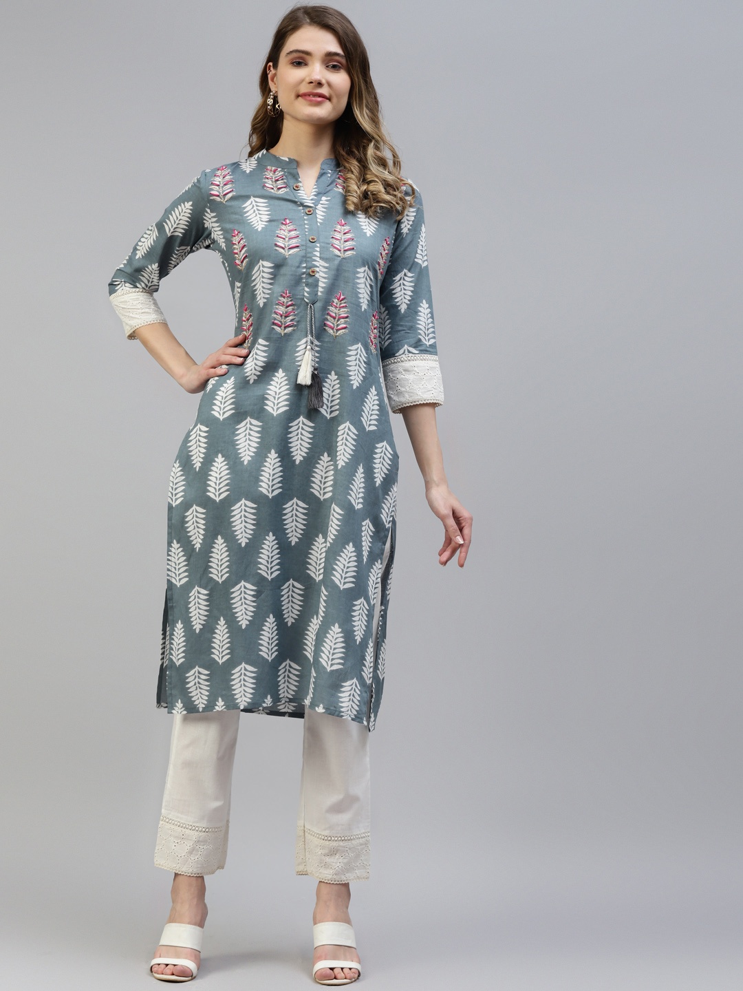 MYAZA Women Grey & White Pure Cotton Floral Print Beads and Stones Kurta with Trousers
MYAZA Women Grey & White Pure Cotton Floral Print Beads and Stones Kurta with Trousers