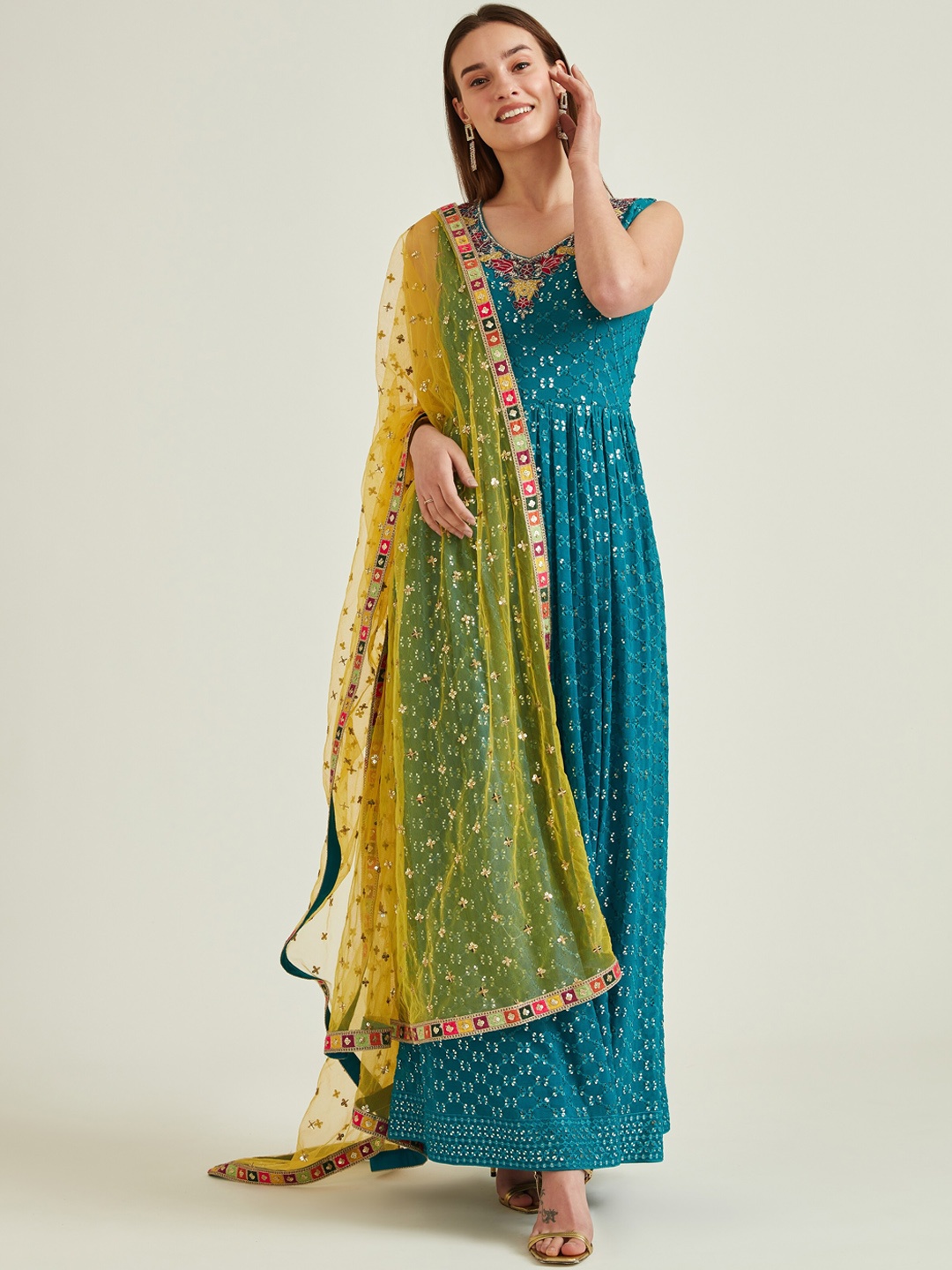 Neerus Turquoise Blue Ethnic Motifs Embellished Anarkali Kurta with Trousers & Dupatta
Neerus Turquoise Blue Ethnic Motifs Embellished Anarkali Kurta with Trousers & Dupatta