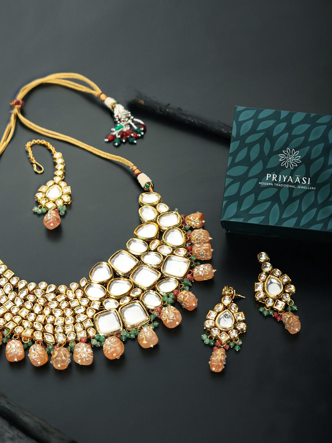 Priyaasi Gold-Plated White & Peach Coloured Kundan-Studded & Pearl Beaded Jewellery Set
Priyaasi Gold-Plated White & Peach Coloured Kundan-Studded & Pearl Beaded Jewellery Set