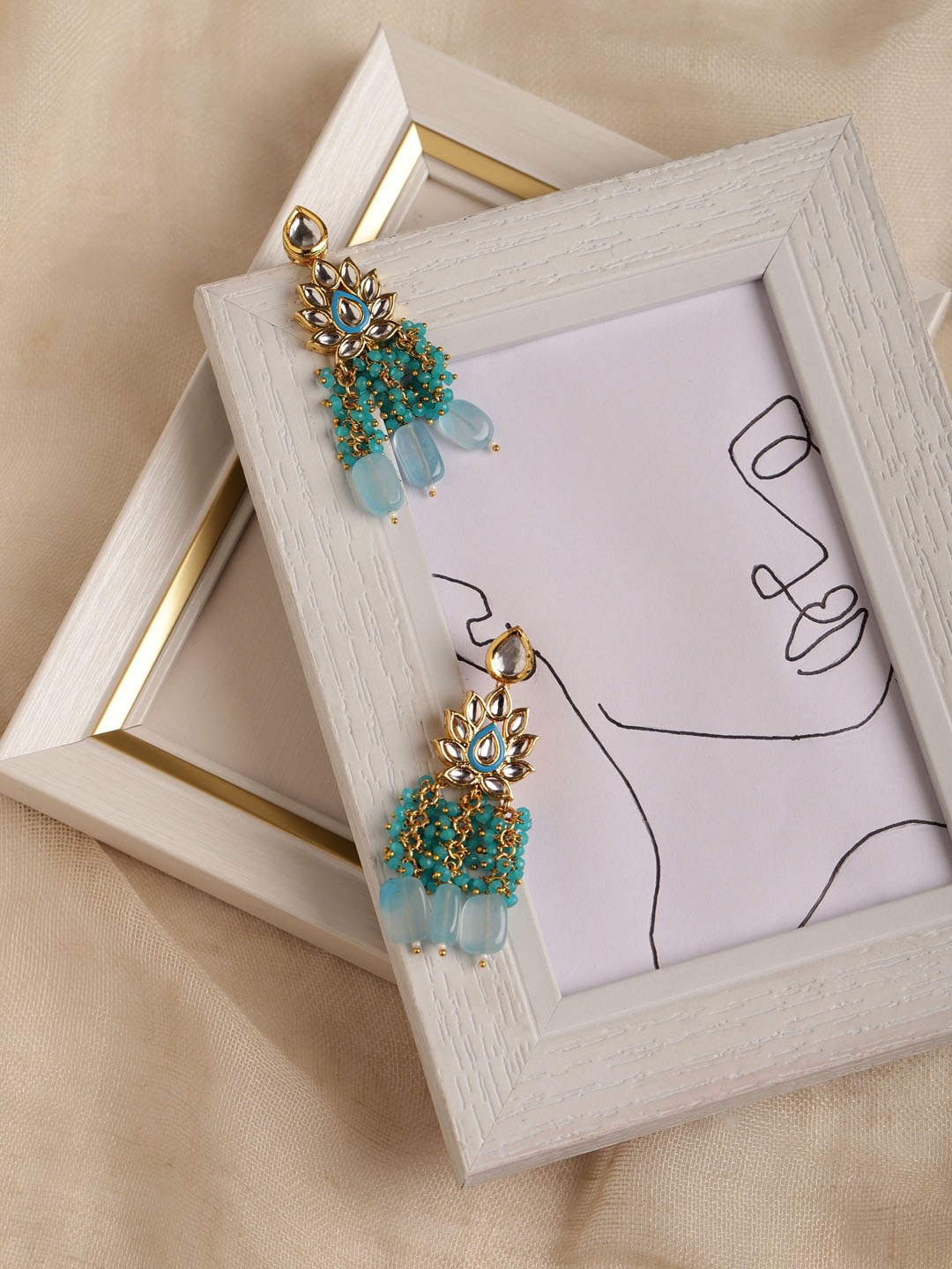 Ruby Raang Gold-Plated Turquoise Blue Kundan Studded Classic Drop Earrings
Ruby Raang Gold-Plated Turquoise Blue Kundan Studded Classic Drop Earrings