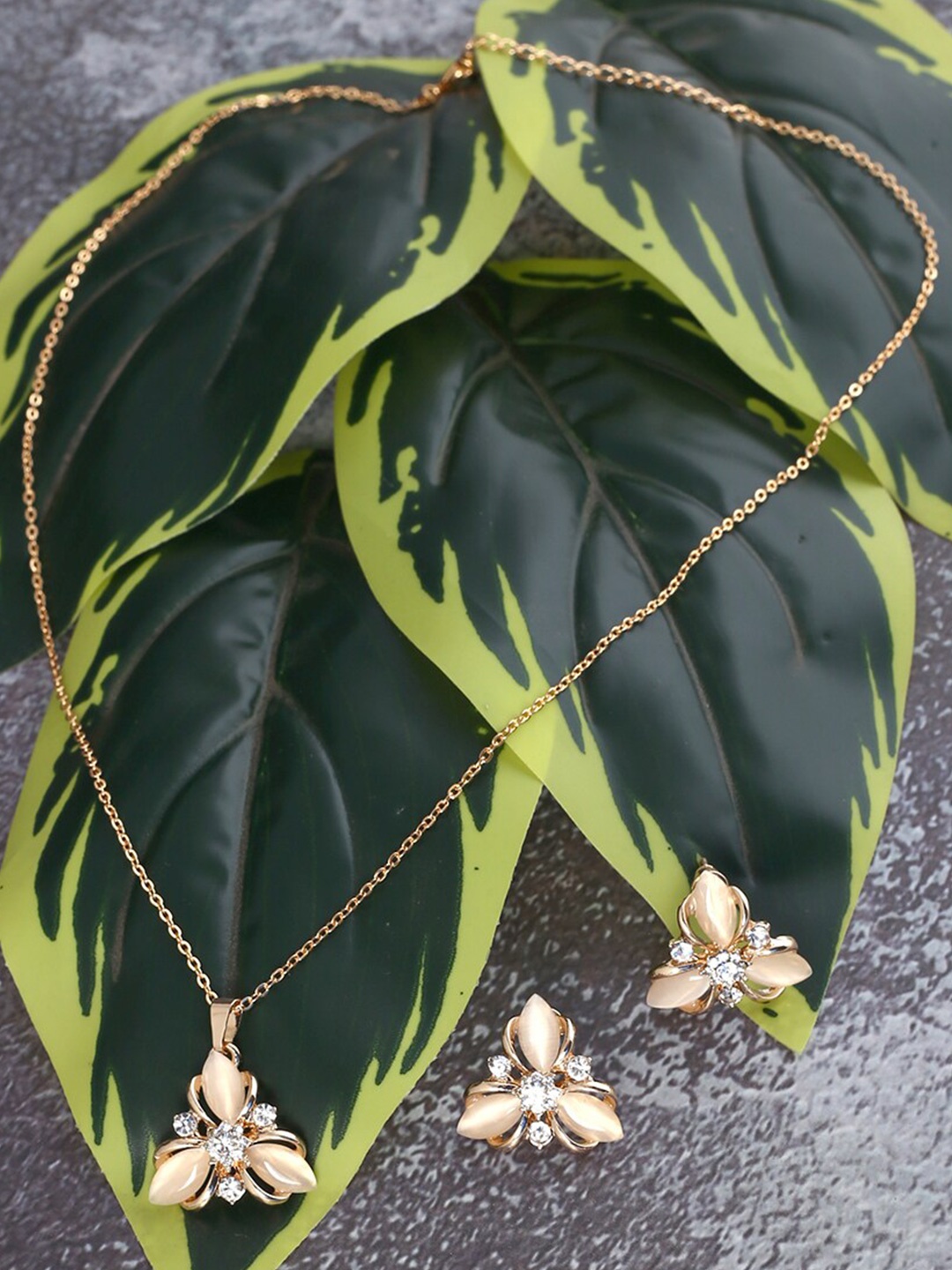 Jewelz Gold-Toned Gold-Plated Chain with Sizzling Flower Shape Pendant and Earring Set
Jewelz Gold-Toned Gold-Plated Chain with Sizzling Flower Shape Pendant and Earring Set