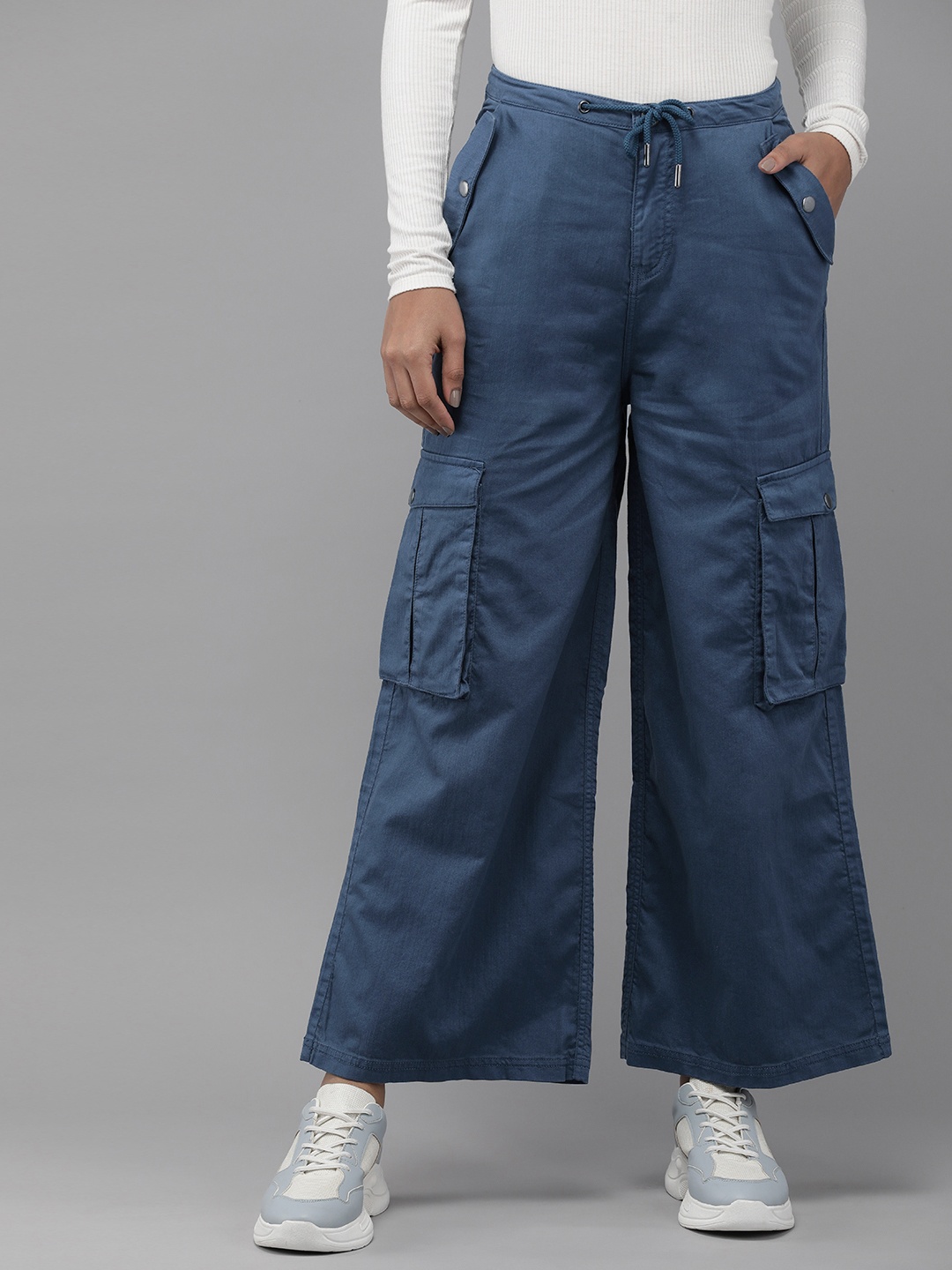 The Roadster Lifestyle Co. Women Flared Cargos Trousers With Drawstring Closure, Blue
The Roadster Lifestyle Co. Women Flared Cargos Trousers With Drawstring Closure, Blue