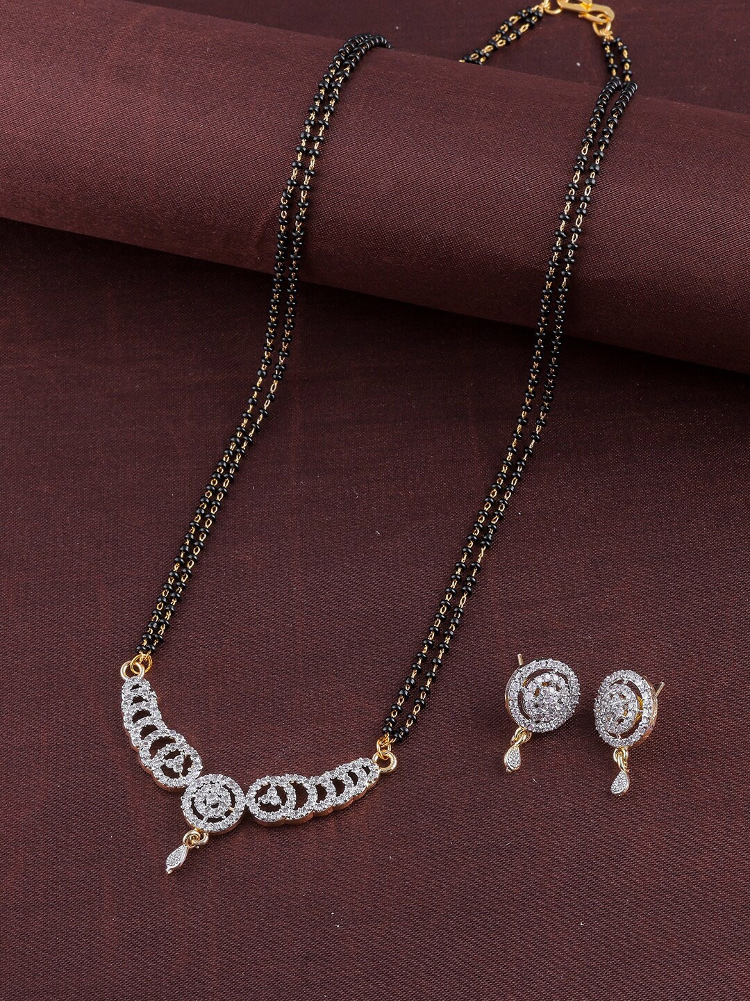 Brandsoon Gold-Plated & Black Beaded AD-Studded Brass Mangalsutra With Earrings, Multi
Brandsoon Gold-Plated & Black Beaded AD-Studded Brass Mangalsutra With Earrings, Multi