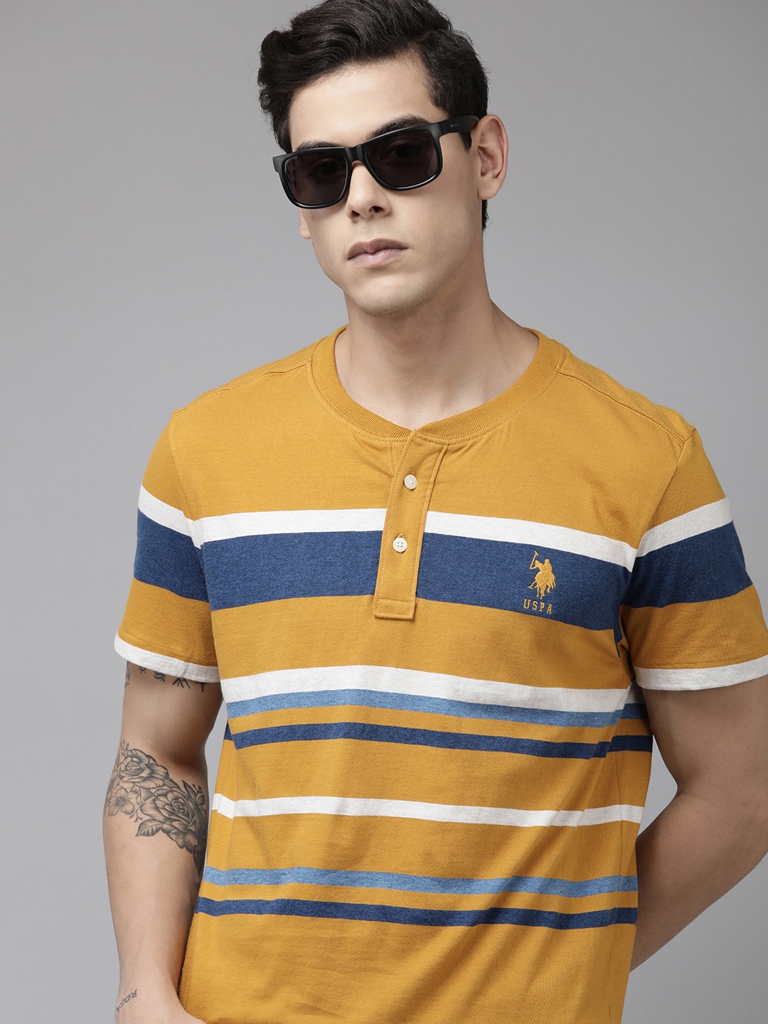 U.S. Polo Assn. Men Mustard Yellow & Blue Striped Henley Neck Pure Cotton Slim Fit T-shirt
U.S. Polo Assn. Men Mustard Yellow & Blue Striped Henley Neck Pure Cotton Slim Fit T-shirt