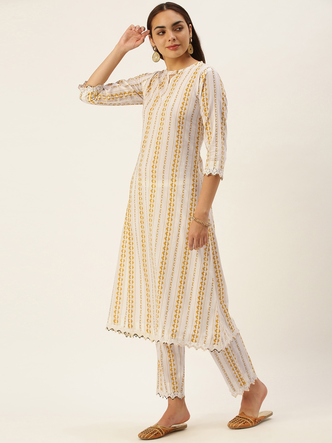 Saanjh Women Off White & Yellow Pure Cotton Geometric Print Sequined Kurta with Trousers
Saanjh Women Off White & Yellow Pure Cotton Geometric Print Sequined Kurta with Trousers