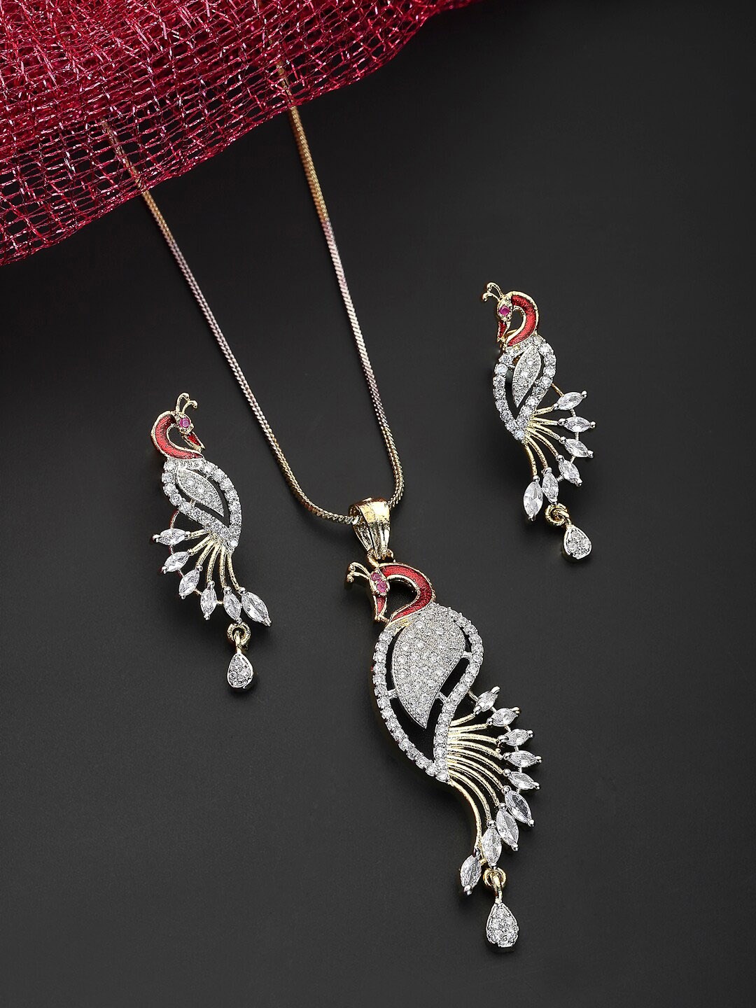 ZENEME Gold-Plated White & Red AD-Studded Peacock Shaped Pendant With Chain & Earrings
ZENEME Gold-Plated White & Red AD-Studded Peacock Shaped Pendant With Chain & Earrings