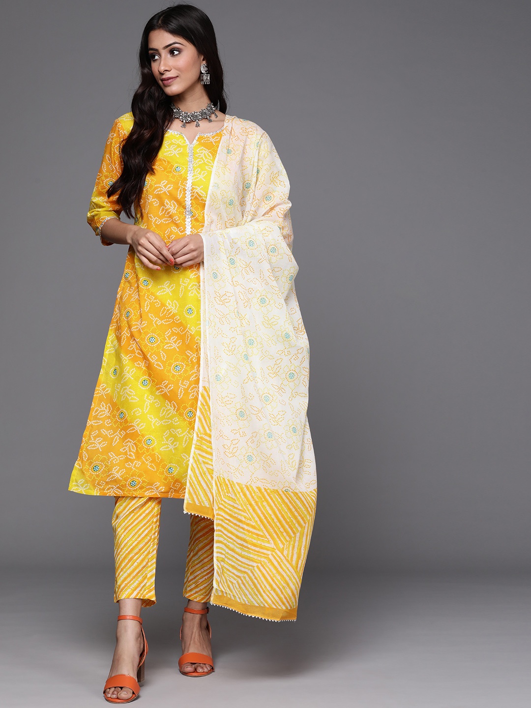 Libas Women Yellow & White Bandhani Print Straight Cotton Kurta with Trousers Dupatta
Libas Women Yellow & White Bandhani Print Straight Cotton Kurta with Trousers Dupatta