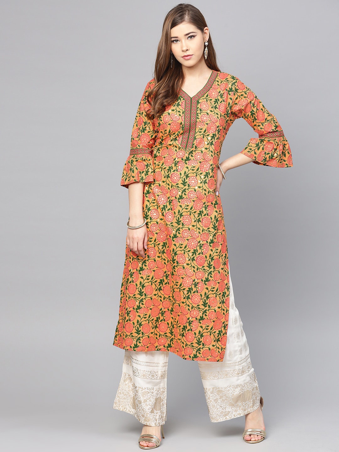 Varanga Women Peach-Coloured & Green Ethnic Motifs Printed Bell Sleeves Cotton Kurta
Varanga Women Peach-Coloured & Green Ethnic Motifs Printed Bell Sleeves Cotton Kurta