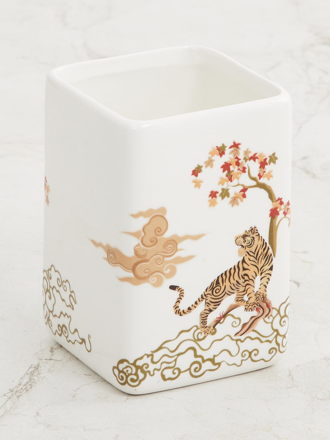 Home Centre White & Brown Art of Asia-Tiger Tales Tian Printed Ceramic Tooth Brush Holder
Home Centre White & Brown Art of Asia-Tiger Tales Tian Printed Ceramic Tooth Brush Holder