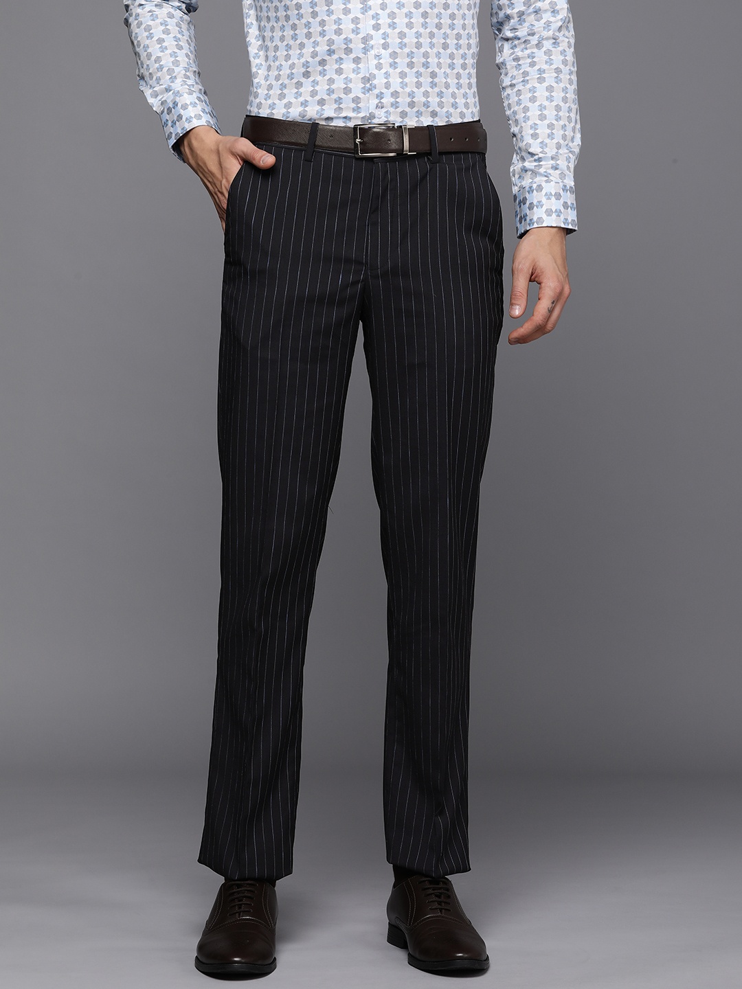 Louis Philippe Men Navy Blue Striped Slim Fit Mid-Rise Plain Flat-Front Formal Trousers
Louis Philippe Men Navy Blue Striped Slim Fit Mid-Rise Plain Flat-Front Formal Trousers