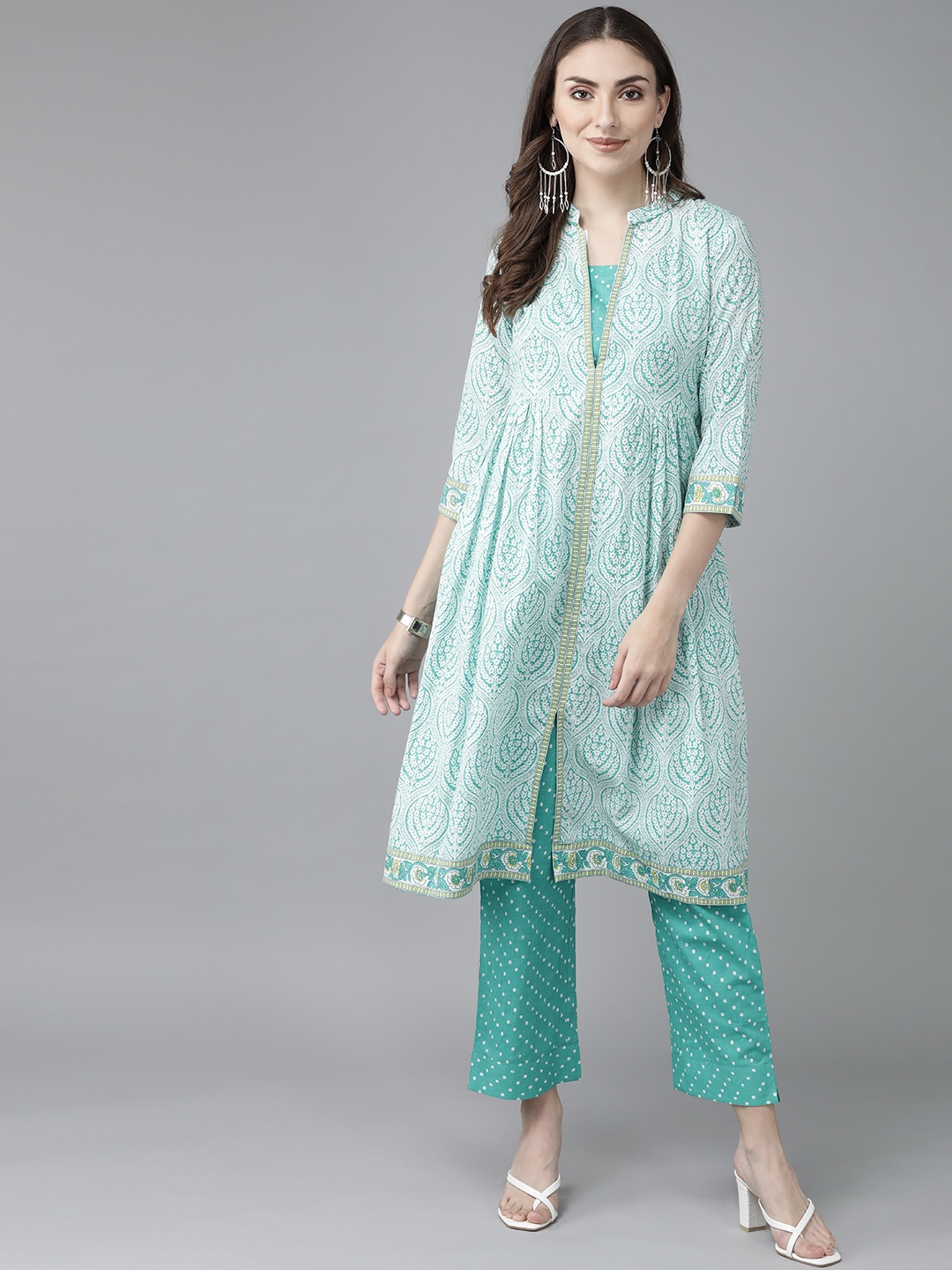 Rain & Rainbow Women Sea Green Ethnic Motifs Printed Sequinned Pure Cotton Kurta with Trousers
Rain & Rainbow Women Sea Green Ethnic Motifs Printed Sequinned Pure Cotton Kurta with Trousers