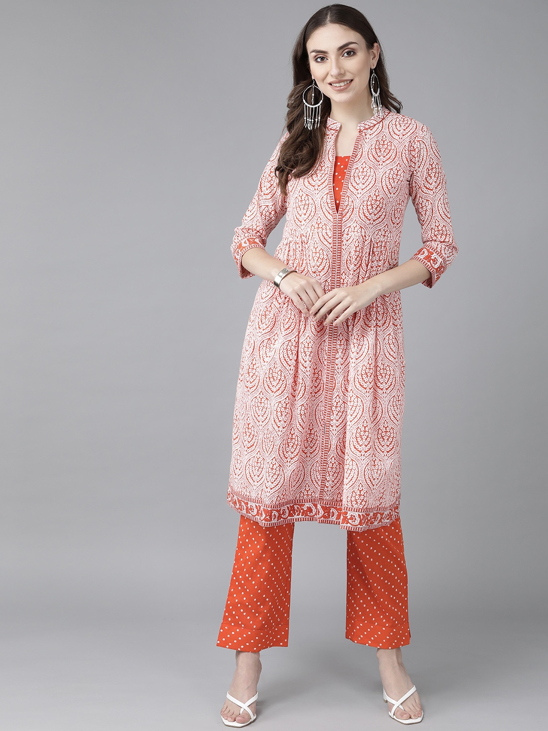 Rain & Rainbow Women Orange Ethnic Motifs Printed Sequinned Pure Cotton Kurta with Trousers
Rain & Rainbow Women Orange Ethnic Motifs Printed Sequinned Pure Cotton Kurta with Trousers