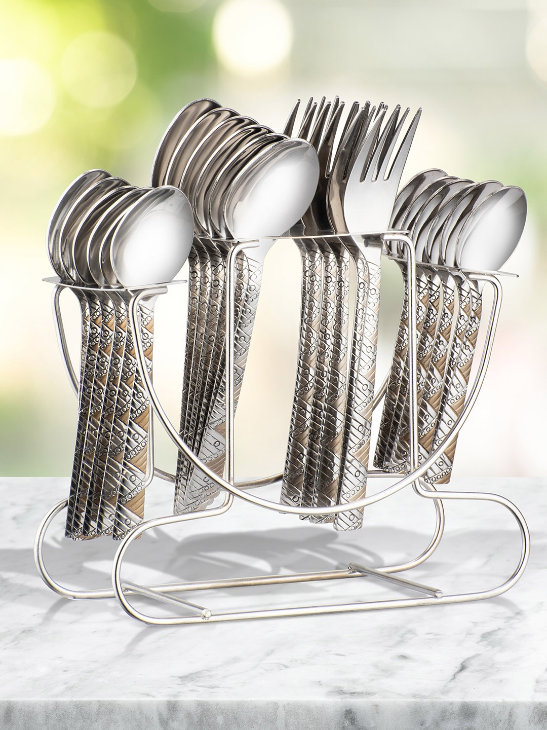 Athome by Nilkamal Set of 24 Arias Bloom Silver Toned Stainless Steel Cutlery With Stand
Athome by Nilkamal Set of 24 Arias Bloom Silver Toned Stainless Steel Cutlery With Stand