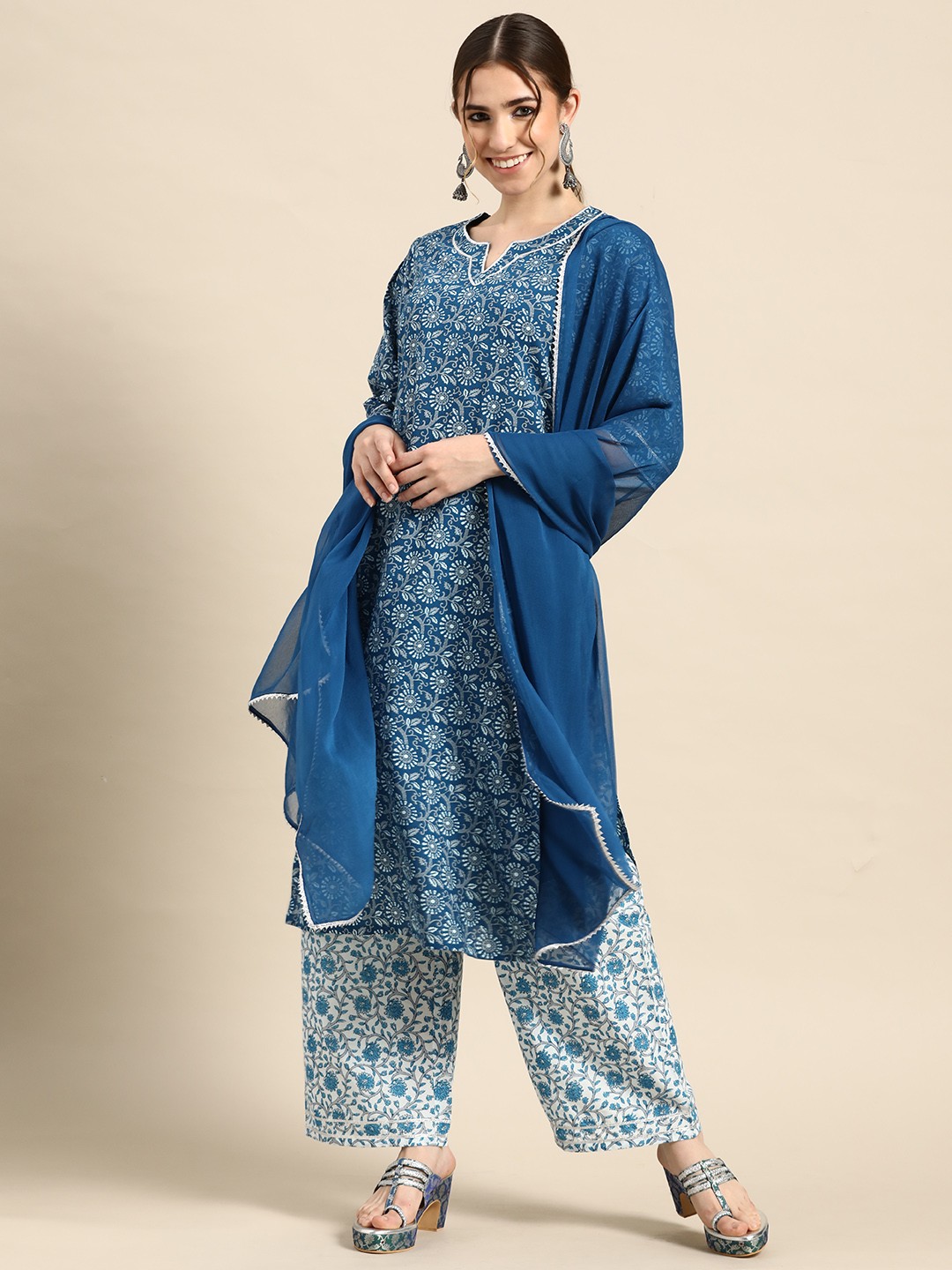 Gerua By Libas Women Blue Floral Motifs Printed Gotta Patti Cotton Kurta with Palazzos Dupatta
Gerua By Libas Women Blue Floral Motifs Printed Gotta Patti Cotton Kurta with Palazzos Dupatta
