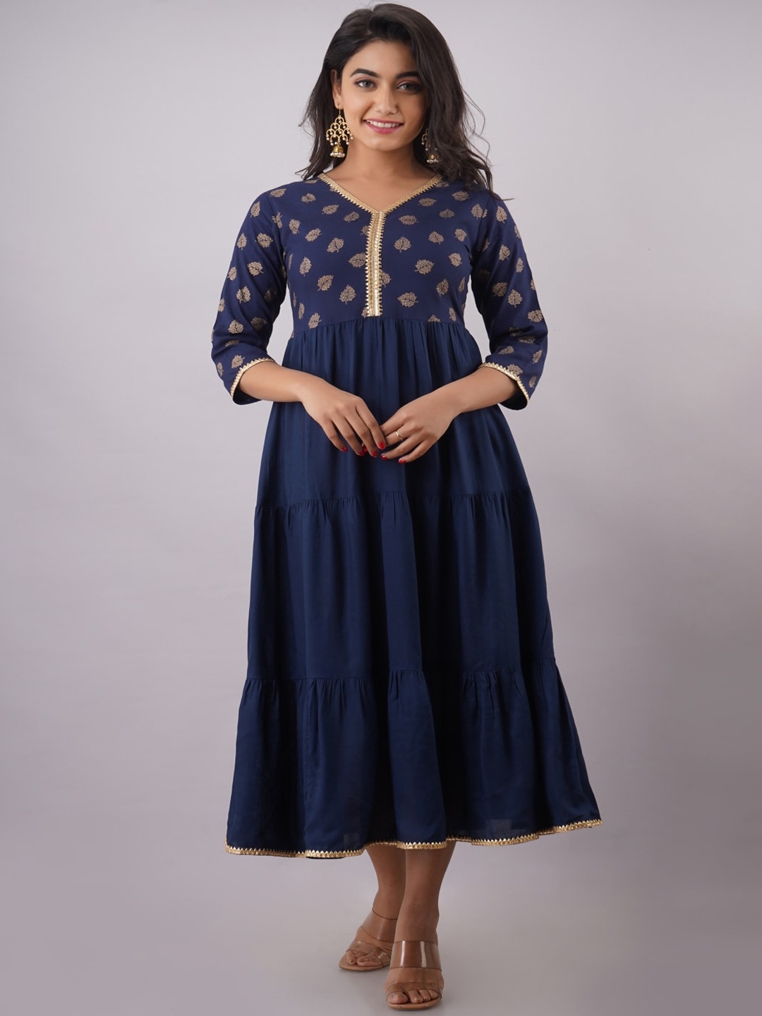 Maishi Blue & Golden Ethnic Motifs Printed Tiered Ethnic Fit & Flare Midi Dress
Maishi Blue & Golden Ethnic Motifs Printed Tiered Ethnic Fit & Flare Midi Dress