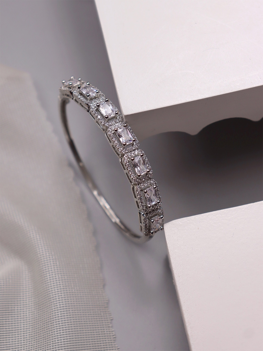 CURIO COTTAGE Women Silver-Toned & White Cubic Zirconia Rhodium-Plated Bangle-Style Bracelet
CURIO COTTAGE Women Silver-Toned & White Cubic Zirconia Rhodium-Plated Bangle-Style Bracelet