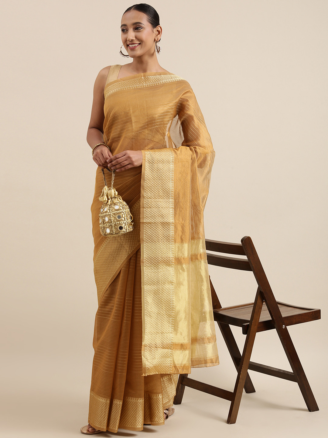 KALINI Brown & Golden Checked Woven Design Saree
KALINI Brown & Golden Checked Woven Design Saree