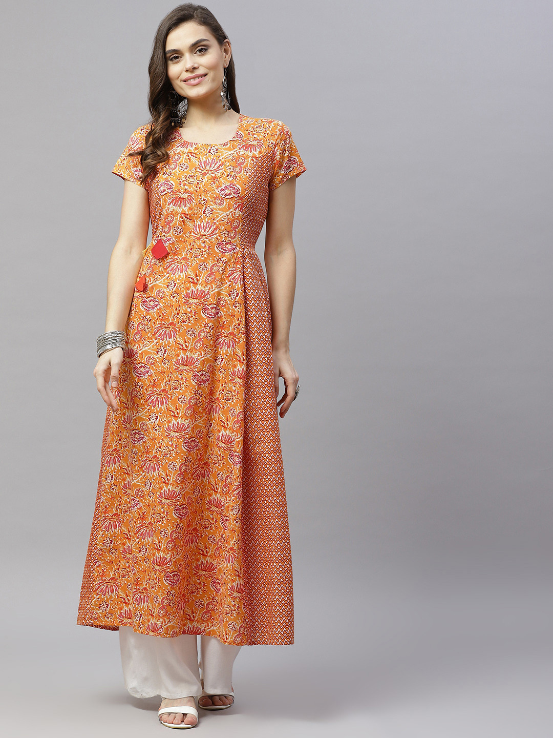 SVARCHI Women Orange & Pink Floral Printed Floral Anarkali Kurta
SVARCHI Women Orange & Pink Floral Printed Floral Anarkali Kurta
