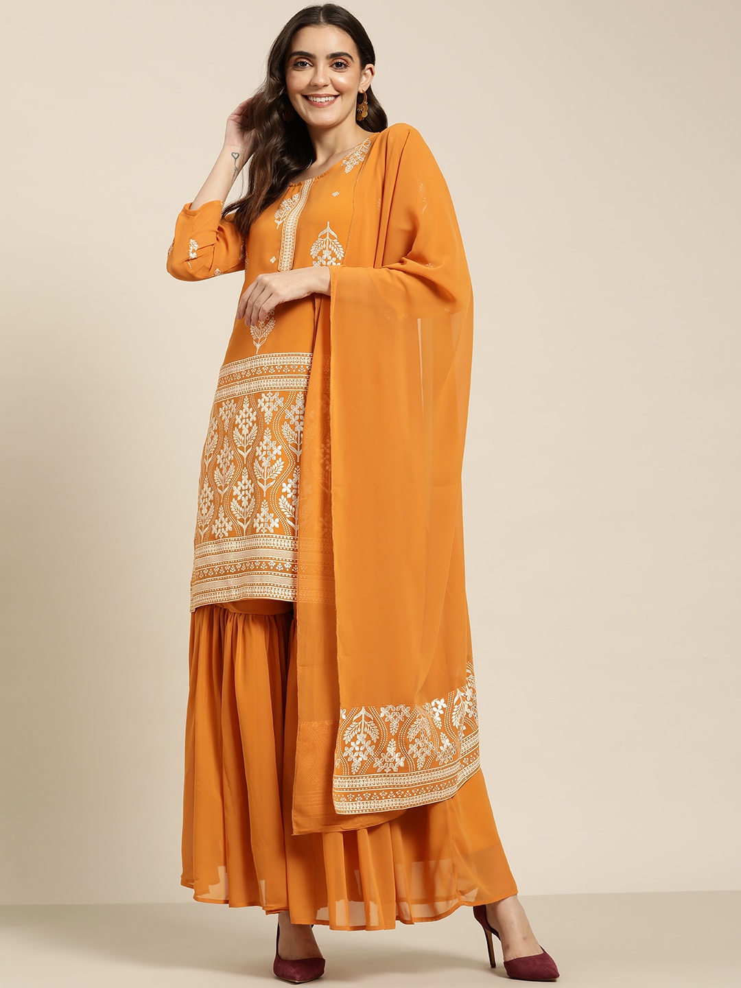 Jompers Women Orange & Silver Ethnic Motifs Foil Printed Straight Kurta Sharara Dupatta
Jompers Women Orange & Silver Ethnic Motifs Foil Printed Straight Kurta Sharara Dupatta