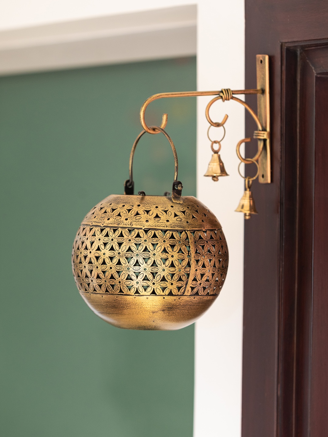 ExclusiveLane Gold-Toned Textured Metal Hanging Tea-Light Candle Holder With Wall Bracket
ExclusiveLane Gold-Toned Textured Metal Hanging Tea-Light Candle Holder With Wall Bracket