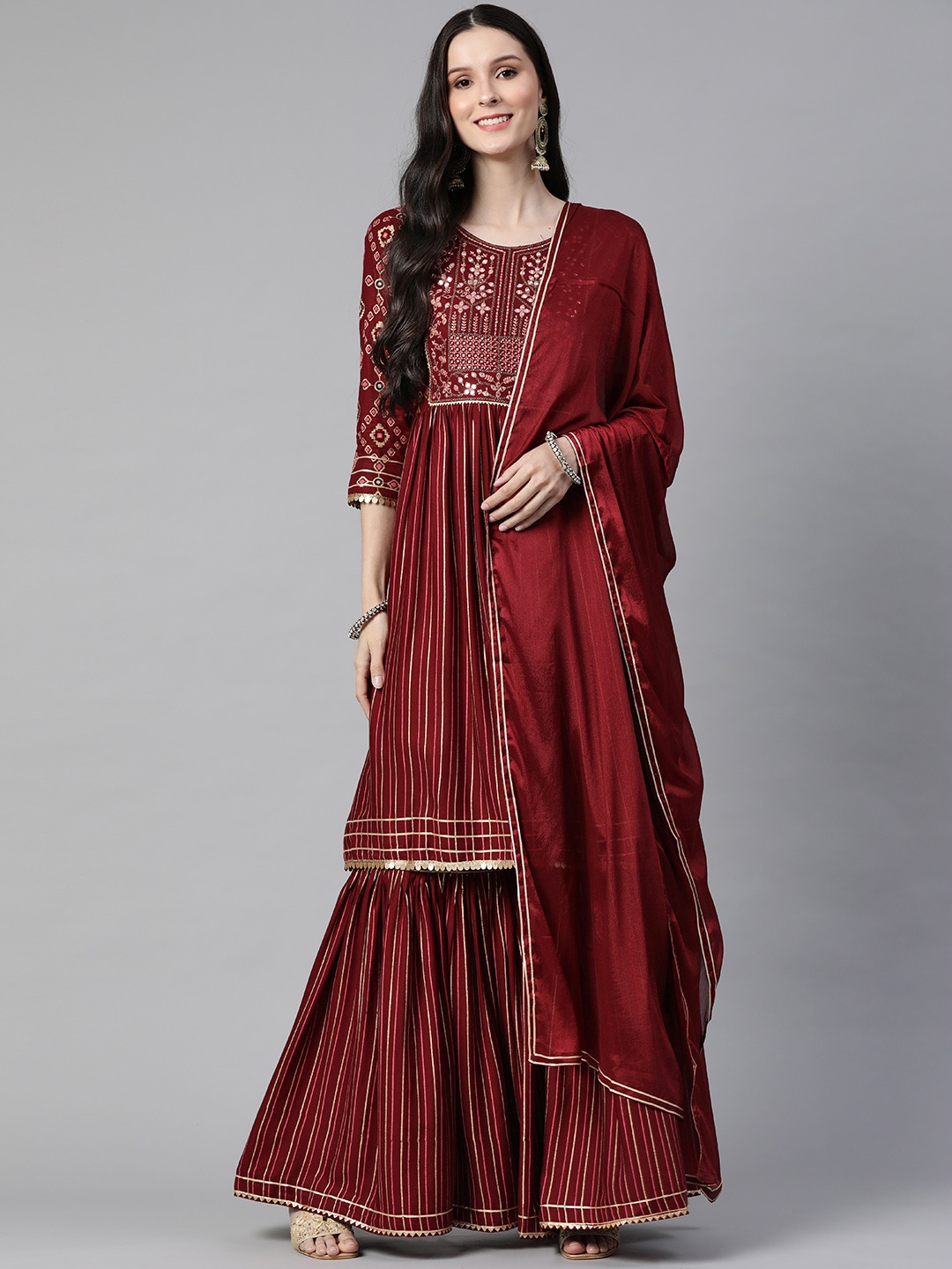 SheWill Women Maroon Floral Embroidered Empire Mirror Work Kurta with Sharara & With Dupatta
SheWill Women Maroon Floral Embroidered Empire Mirror Work Kurta with Sharara & With Dupatta