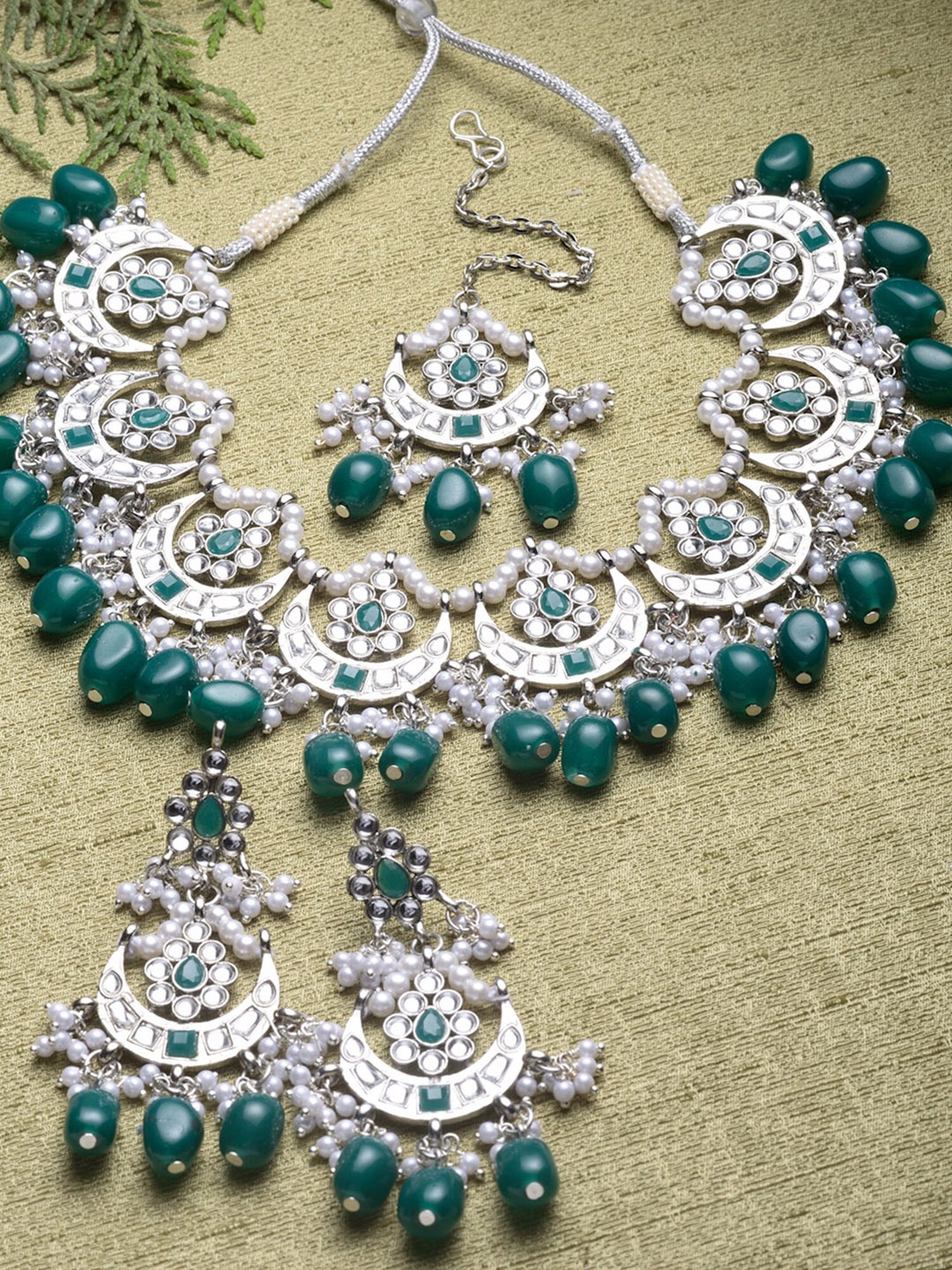 KARATCART Silver-Plated Green & White Kundan Studded & Beaded Oxidised Jewellery Set
KARATCART Silver-Plated Green & White Kundan Studded & Beaded Oxidised Jewellery Set