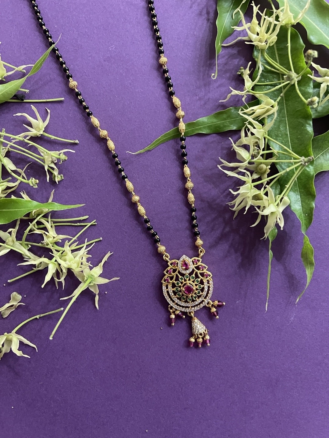 Digital Dress Room Women Gold-Plated Black & White and Red Stone-Studded & Beaded Mangalsutra
Digital Dress Room Women Gold-Plated Black & White and Red Stone-Studded & Beaded Mangalsutra