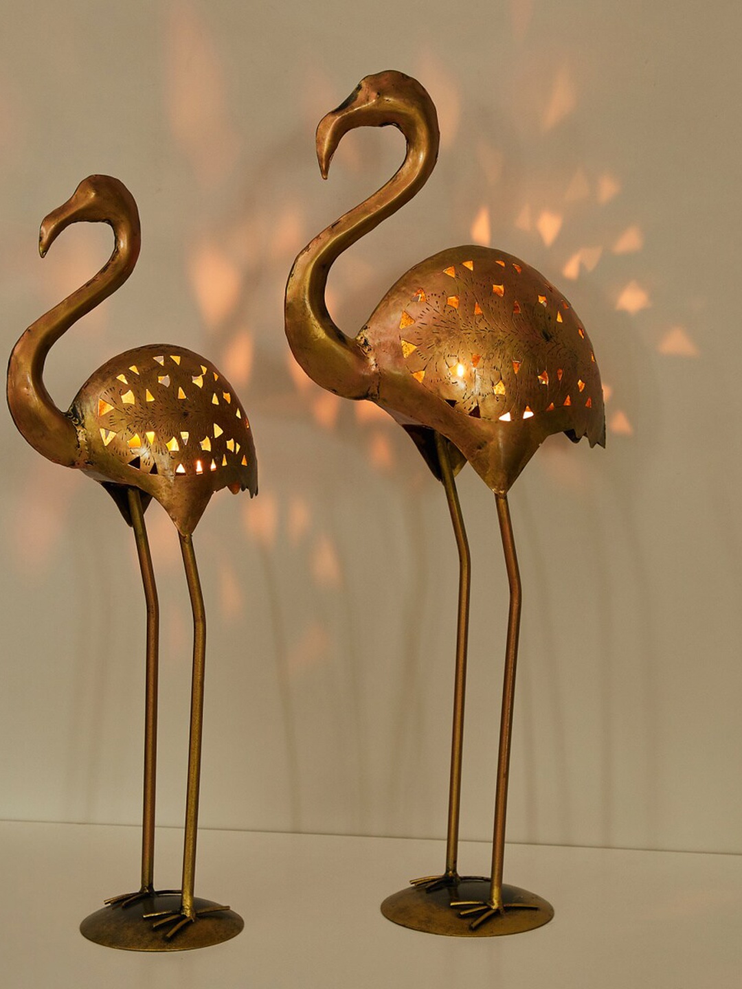 Home Centre Set Of 2 Copper-Toned Solid Jali Cutting Saras Tealight Holder Showpieces
Home Centre Set Of 2 Copper-Toned Solid Jali Cutting Saras Tealight Holder Showpieces