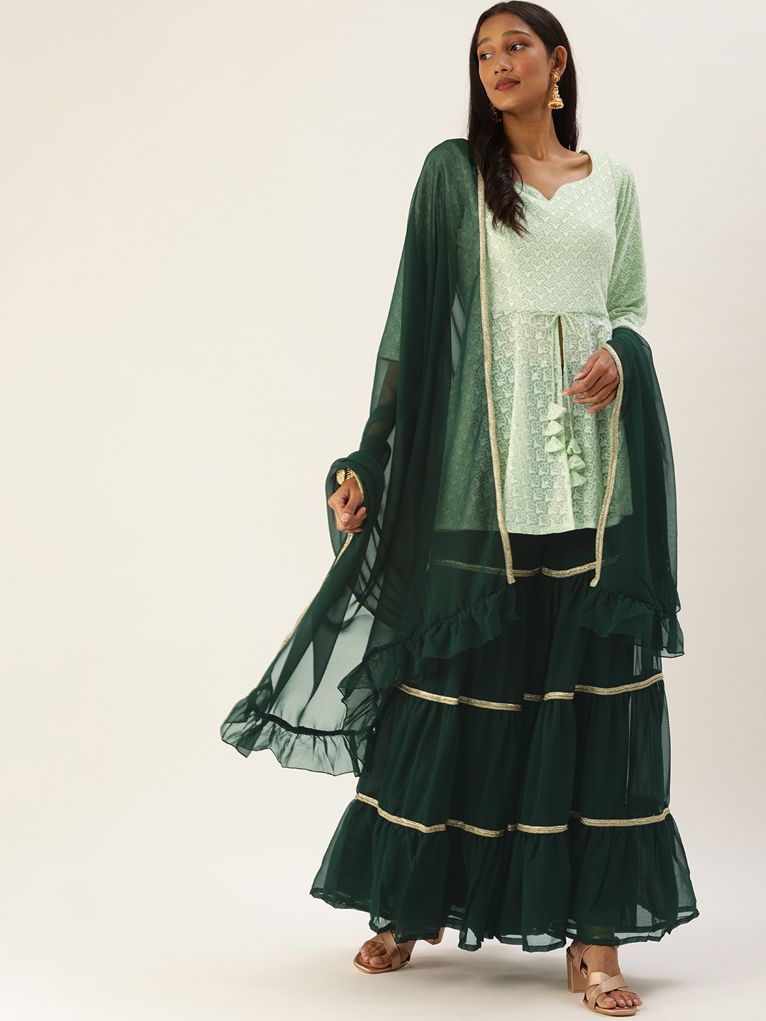 Ethnovog Women Green Ethnic Motifs Embroidered Thread Work Kurta with Sharara With Dupatta
Ethnovog Women Green Ethnic Motifs Embroidered Thread Work Kurta with Sharara With Dupatta