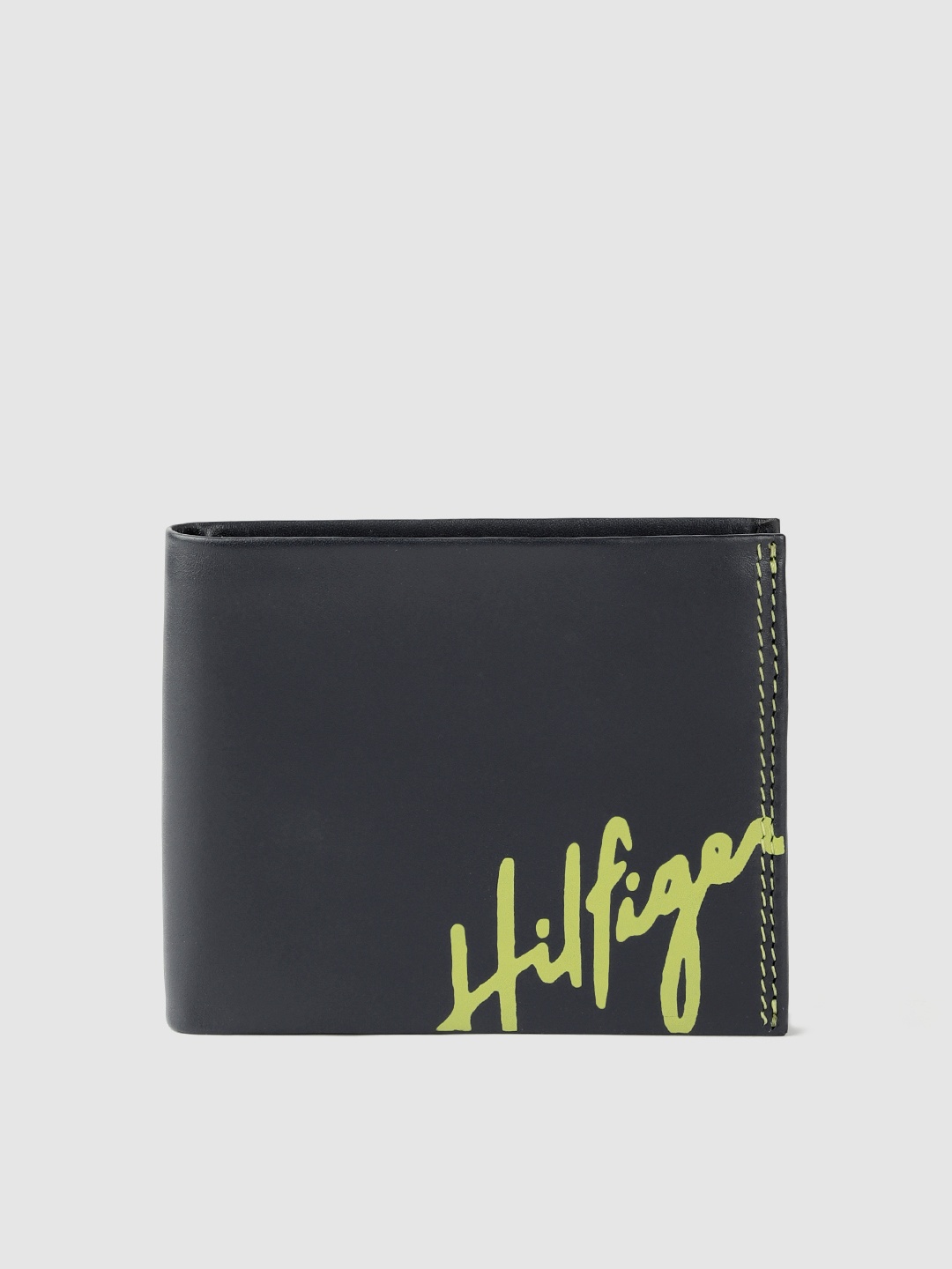 Tommy Hilfiger Men Navy Blue & Lime Green Brand Logo Printed Two Fold Leather Wallet
Tommy Hilfiger Men Navy Blue & Lime Green Brand Logo Printed Two Fold Leather Wallet