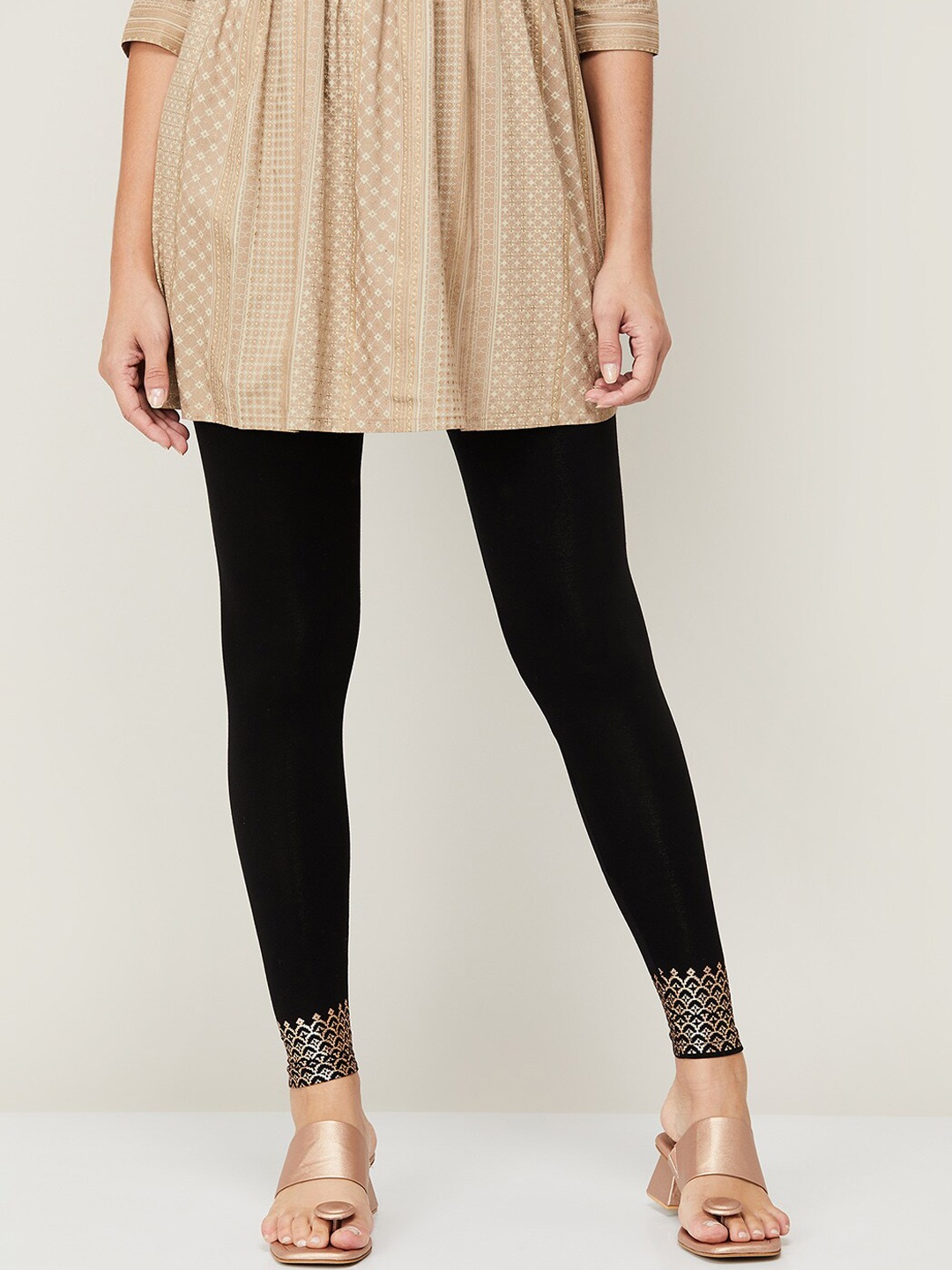 Melange by Lifestyle Women Black & Gold Colored Printed Comfort-Fit Ankle-Length Leggings
Melange by Lifestyle Women Black & Gold Colored Printed Comfort-Fit Ankle-Length Leggings