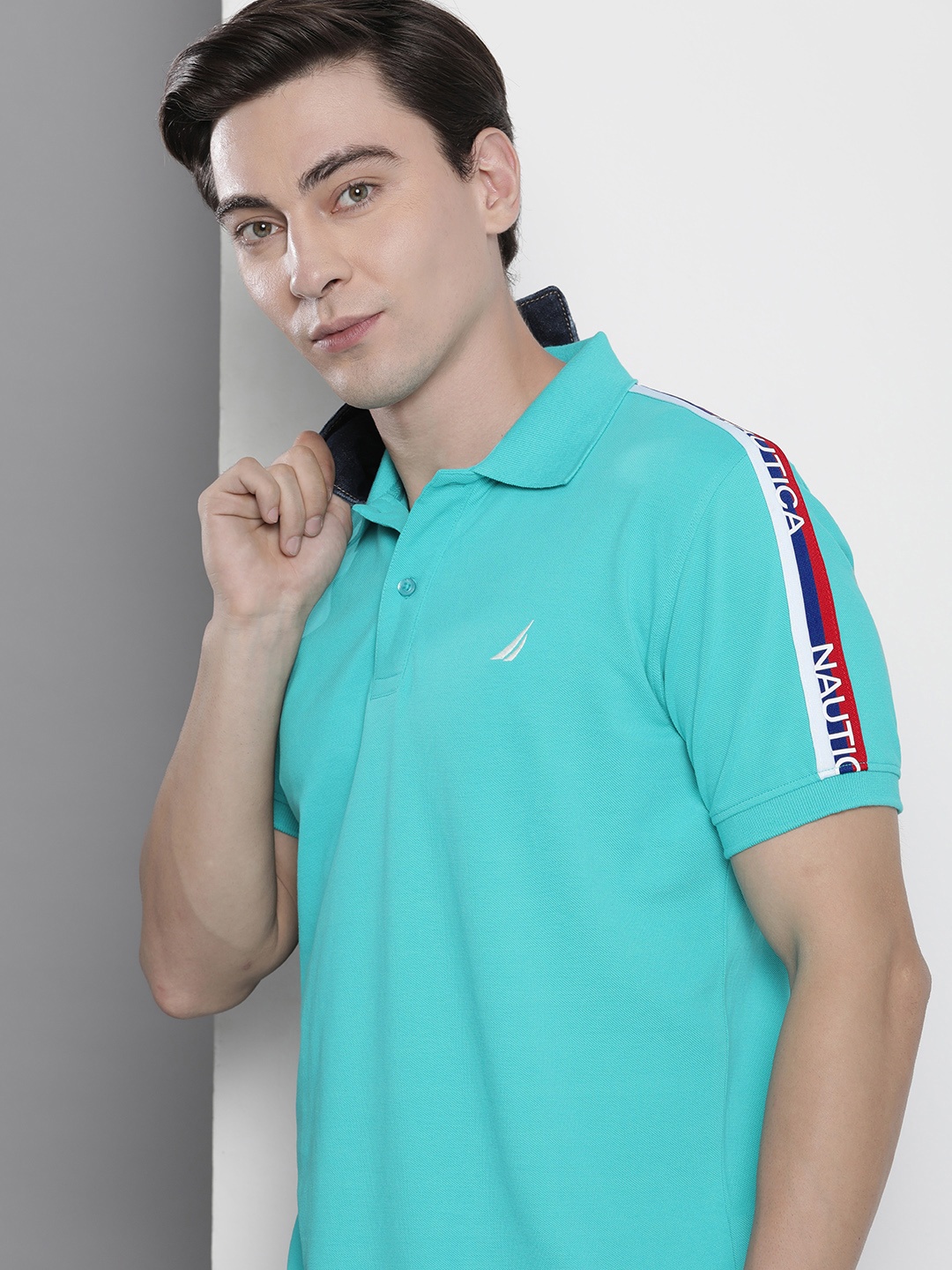 Nautica Men Blue & White Brand Logo Printed Polo Collar Applique Pure Cotton T-shirt
Nautica Men Blue & White Brand Logo Printed Polo Collar Applique Pure Cotton T-shirt