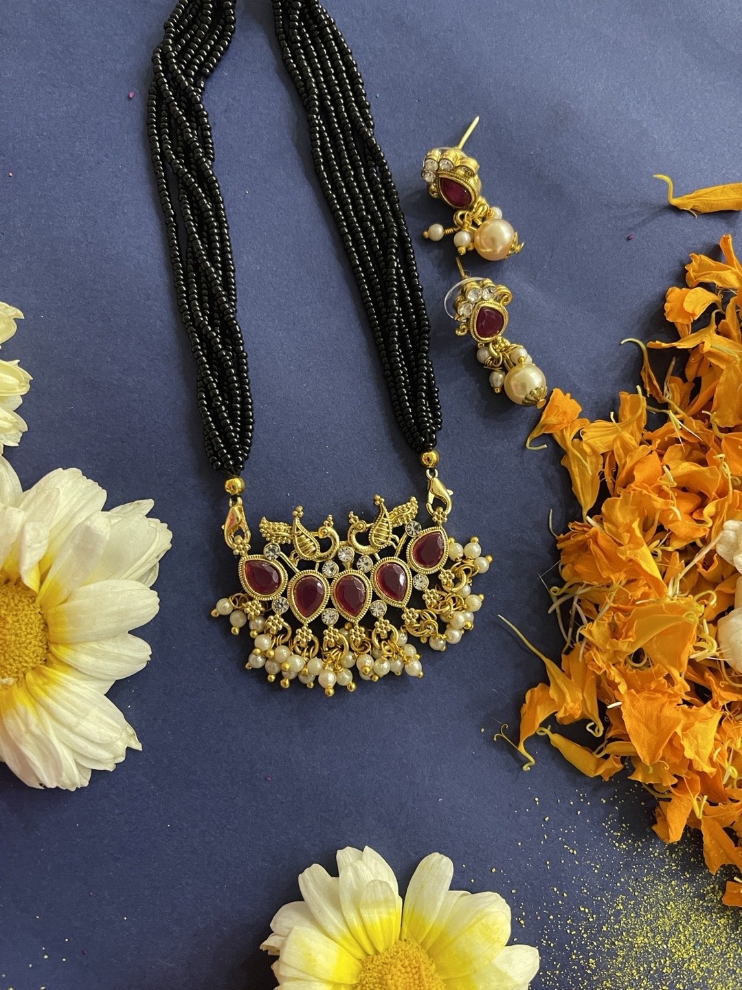 Digital Dress Room Gold-Plated Red Stone-Studded & Pearl-Beaded & Black Beaded Mangalsutra
Digital Dress Room Gold-Plated Red Stone-Studded & Pearl-Beaded & Black Beaded Mangalsutra