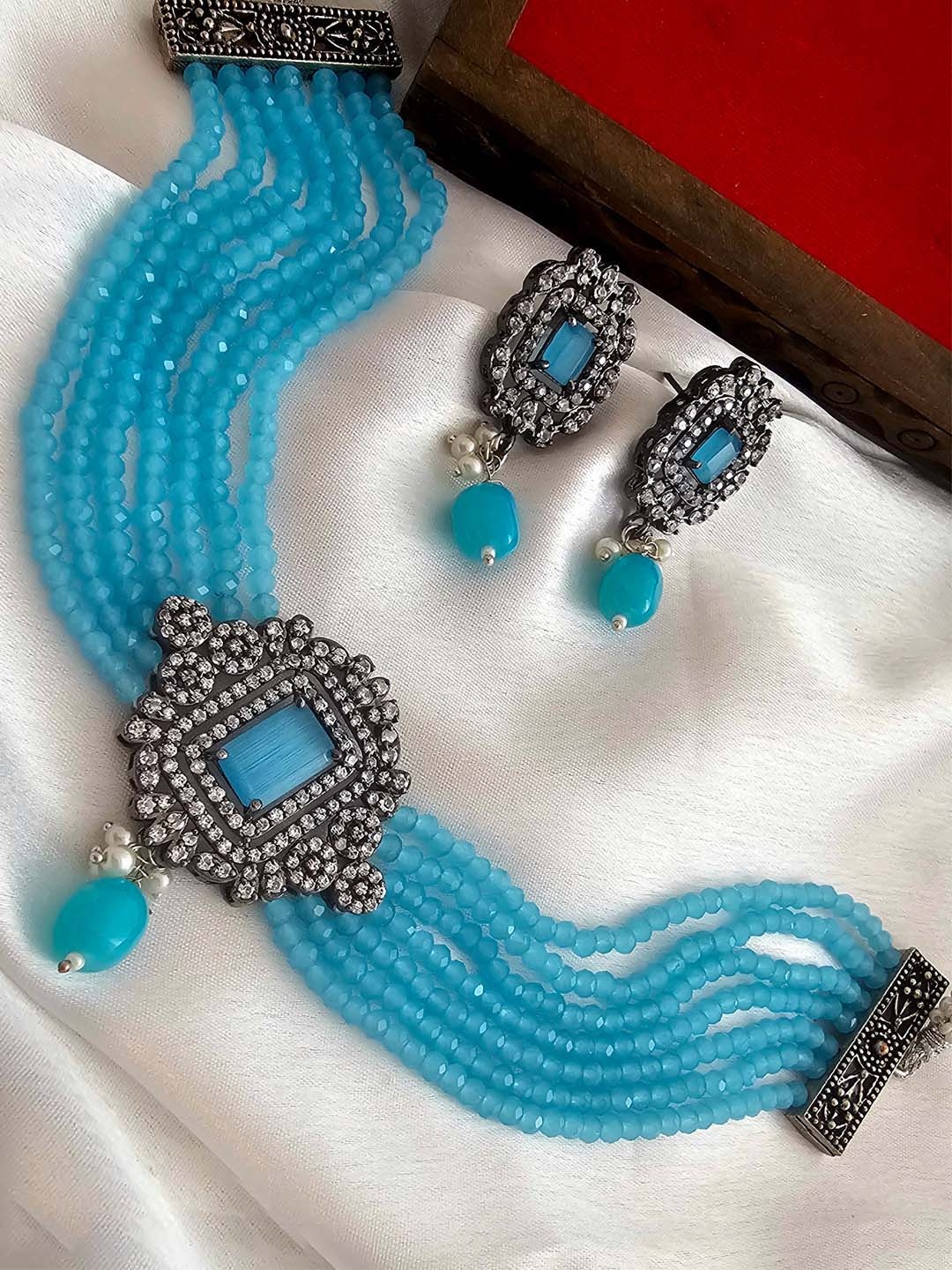 Binnis Wardrobe Women Silver Plated Blue stone-studded and pearl-beaded Choker Jewellery Set
Binnis Wardrobe Women Silver Plated Blue stone-studded and pearl-beaded Choker Jewellery Set