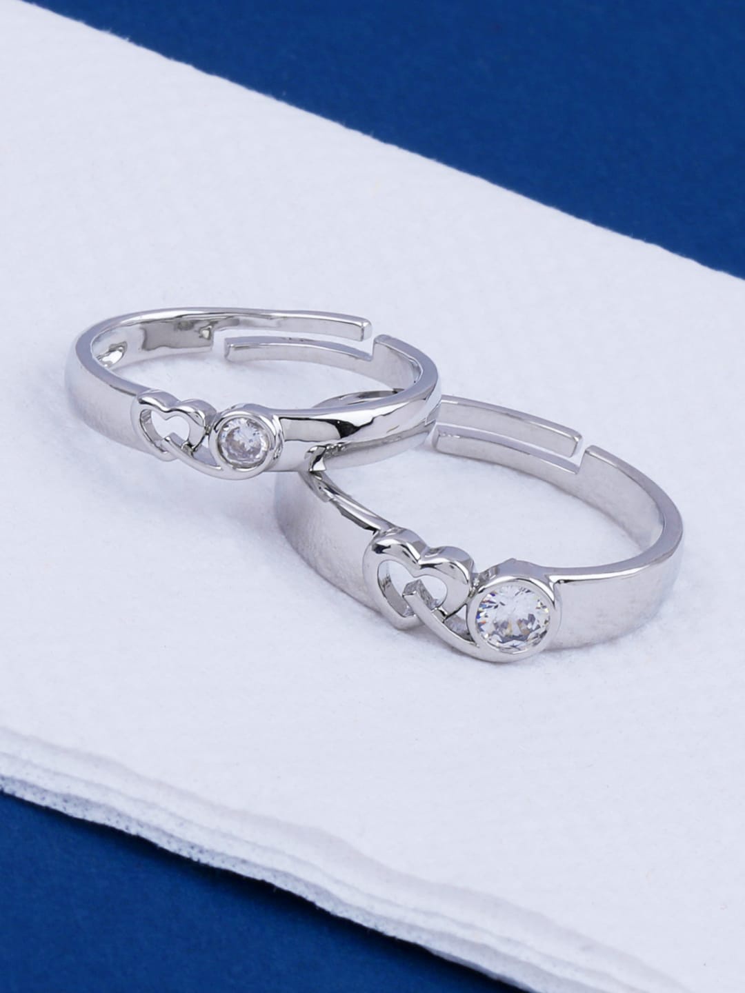 Silver Shine Set Of 2 Rhodium-Plated White CZ-Studded Embrace Heart Couple Adjustable Finger Rings
Silver Shine Set Of 2 Rhodium-Plated White CZ-Studded Embrace Heart Couple Adjustable Finger Rings
