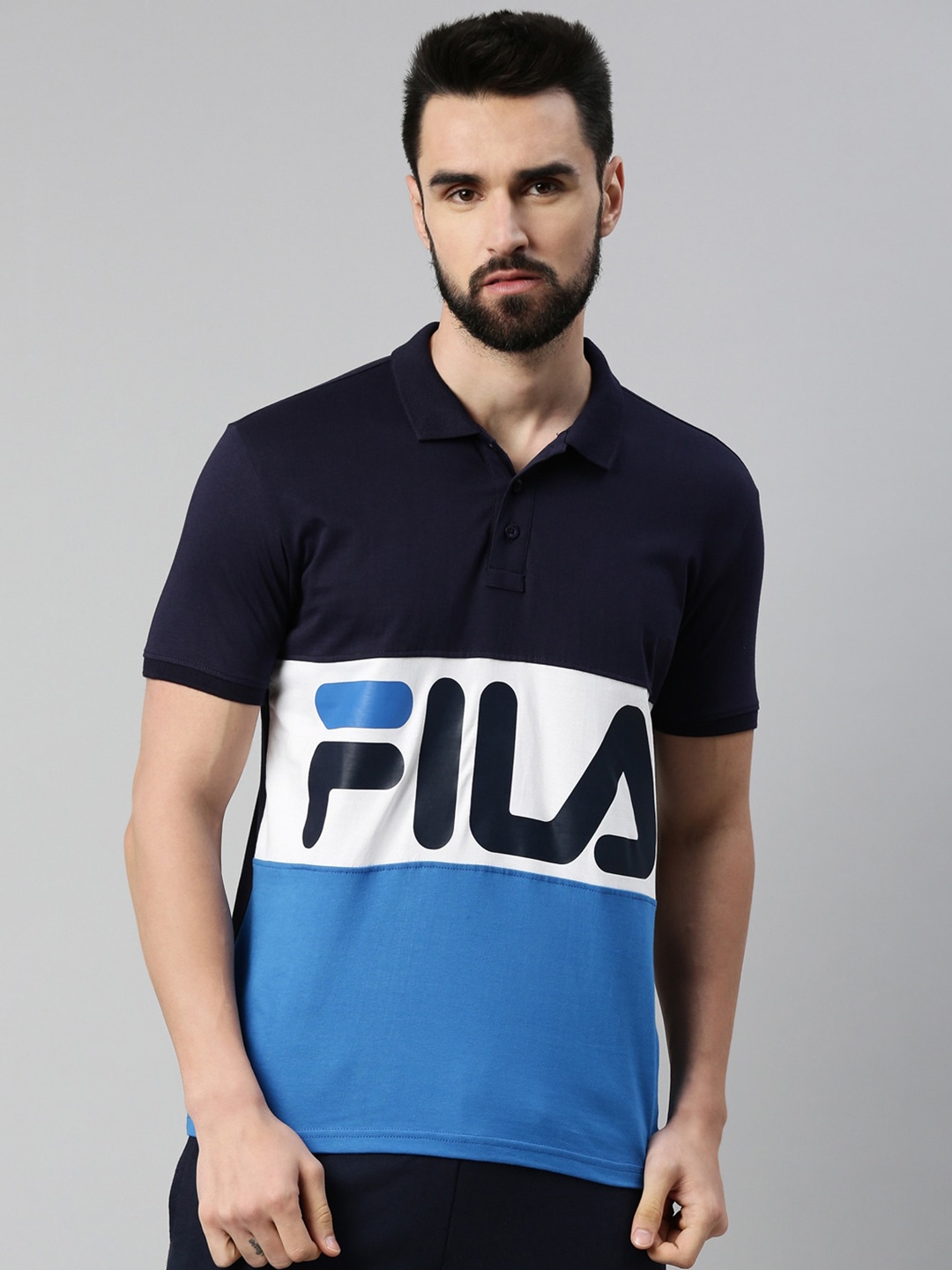 FILA Men Navy Blue & White Brand Logo Colourblocked Polo Collar Organic Cotton Applique T-shirt
FILA Men Navy Blue & White Brand Logo Colourblocked Polo Collar Organic Cotton Applique T-shirt
