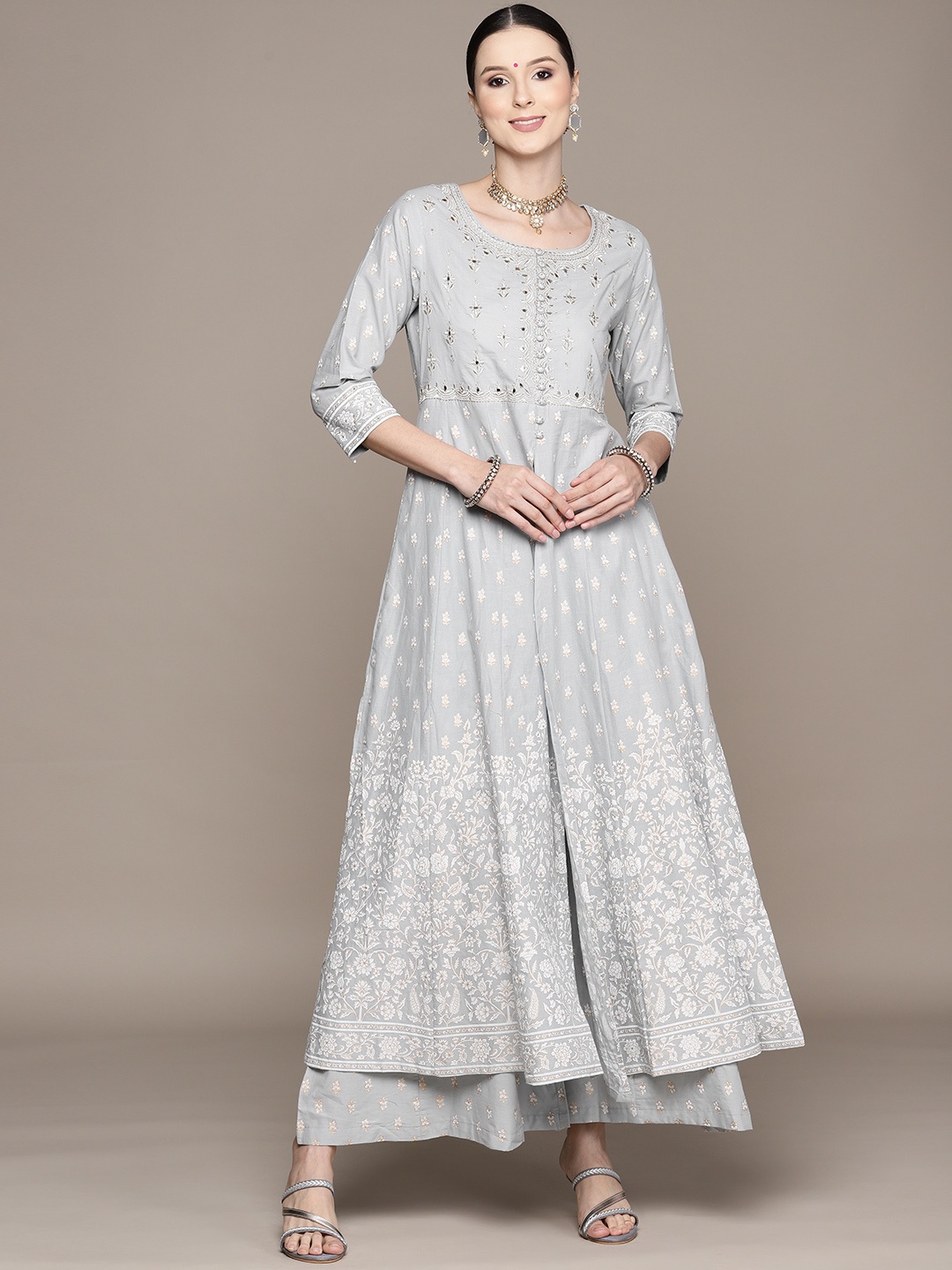 Ishin Women Grey Floral Embroidered High Slit Mirror Work Pure Cotton Kurta with Sharara
Ishin Women Grey Floral Embroidered High Slit Mirror Work Pure Cotton Kurta with Sharara
