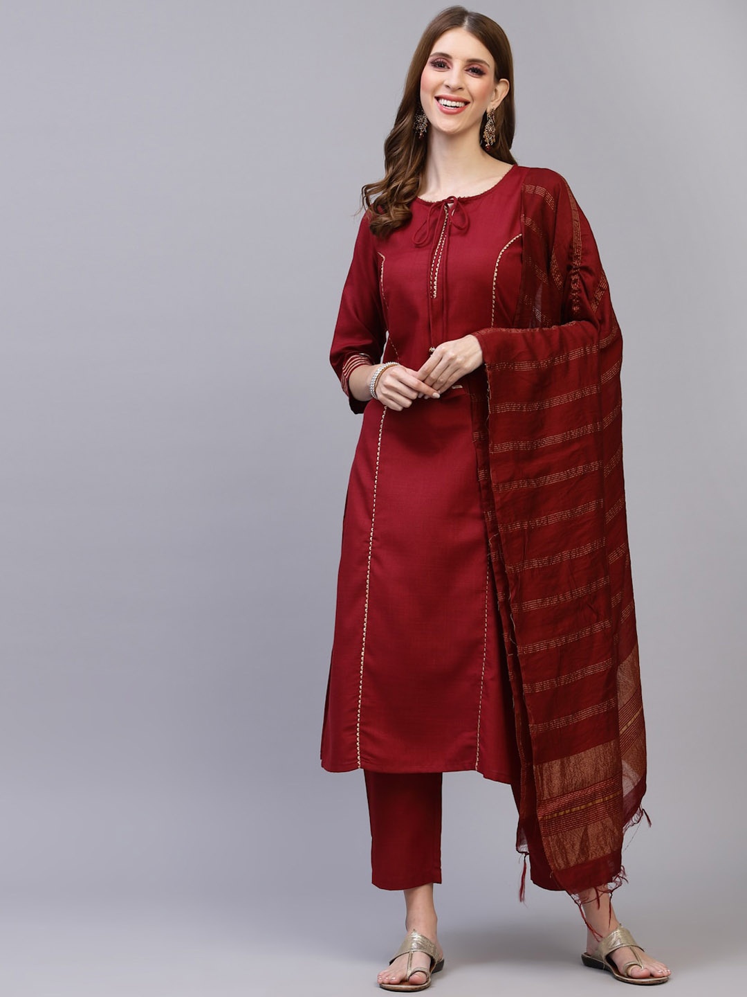SERONA FABRICS Women Maroon Striped Layered Gotta Patti Kurti with Trousers & With Dupatta
SERONA FABRICS Women Maroon Striped Layered Gotta Patti Kurti with Trousers & With Dupatta