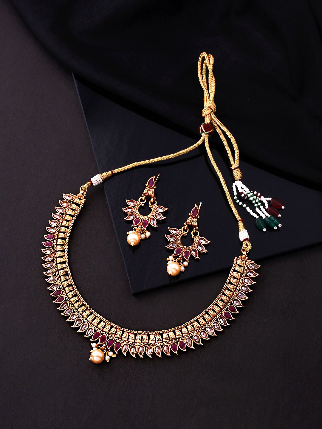 Yellow Chimes Women Gold Tonned Floral Designed White and Red Crystal Studded Choker Jewellery Set
Yellow Chimes Women Gold Tonned Floral Designed White and Red Crystal Studded Choker Jewellery Set