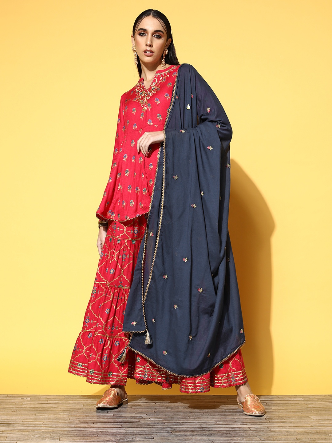 Indo Era Women Coral Red Ethnic Motifs Printed Pleated A-Line Kurta with Sharara & Dupatta
Indo Era Women Coral Red Ethnic Motifs Printed Pleated A-Line Kurta with Sharara & Dupatta